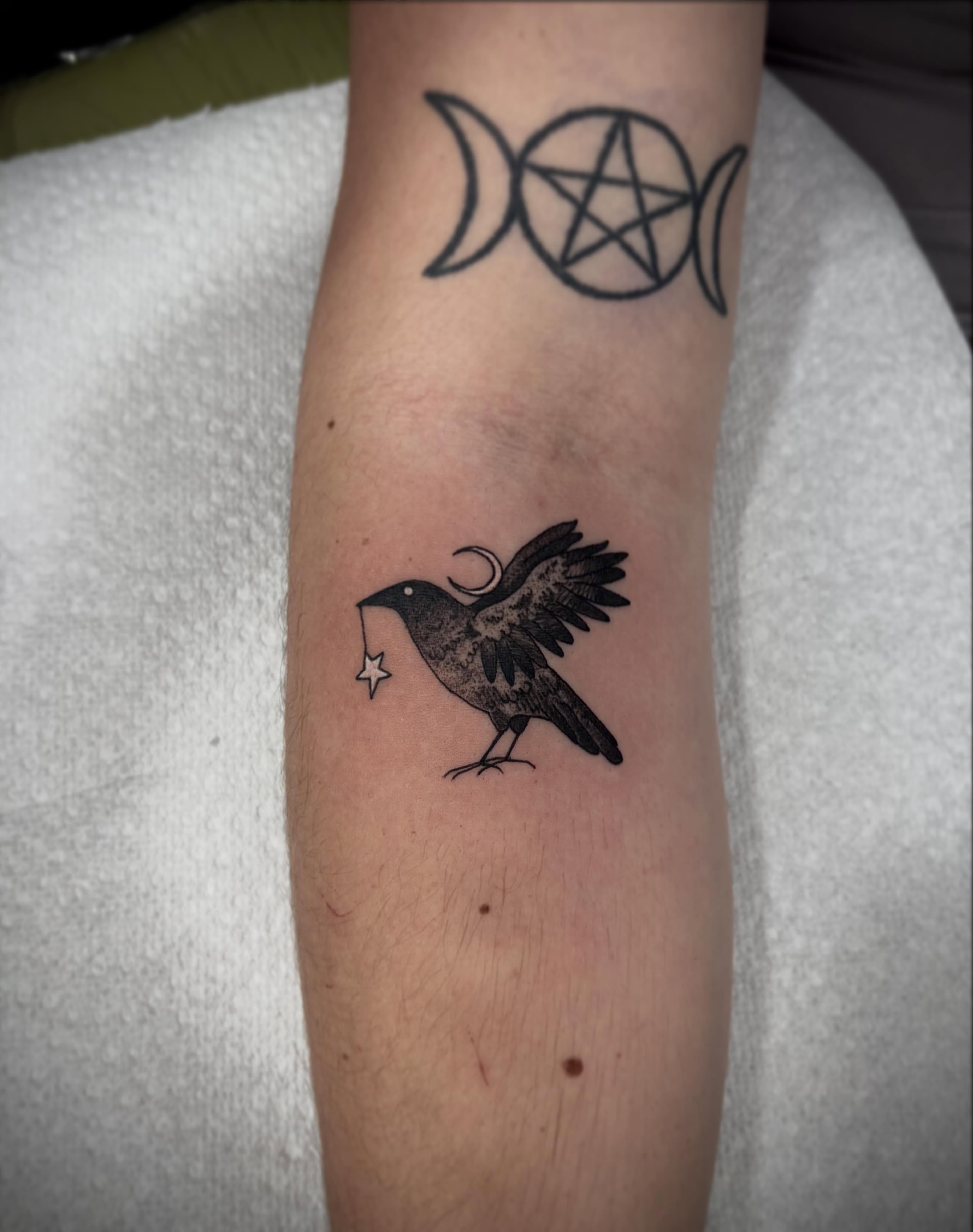 Crow black and grey tattoo on the forearm by destiney rose