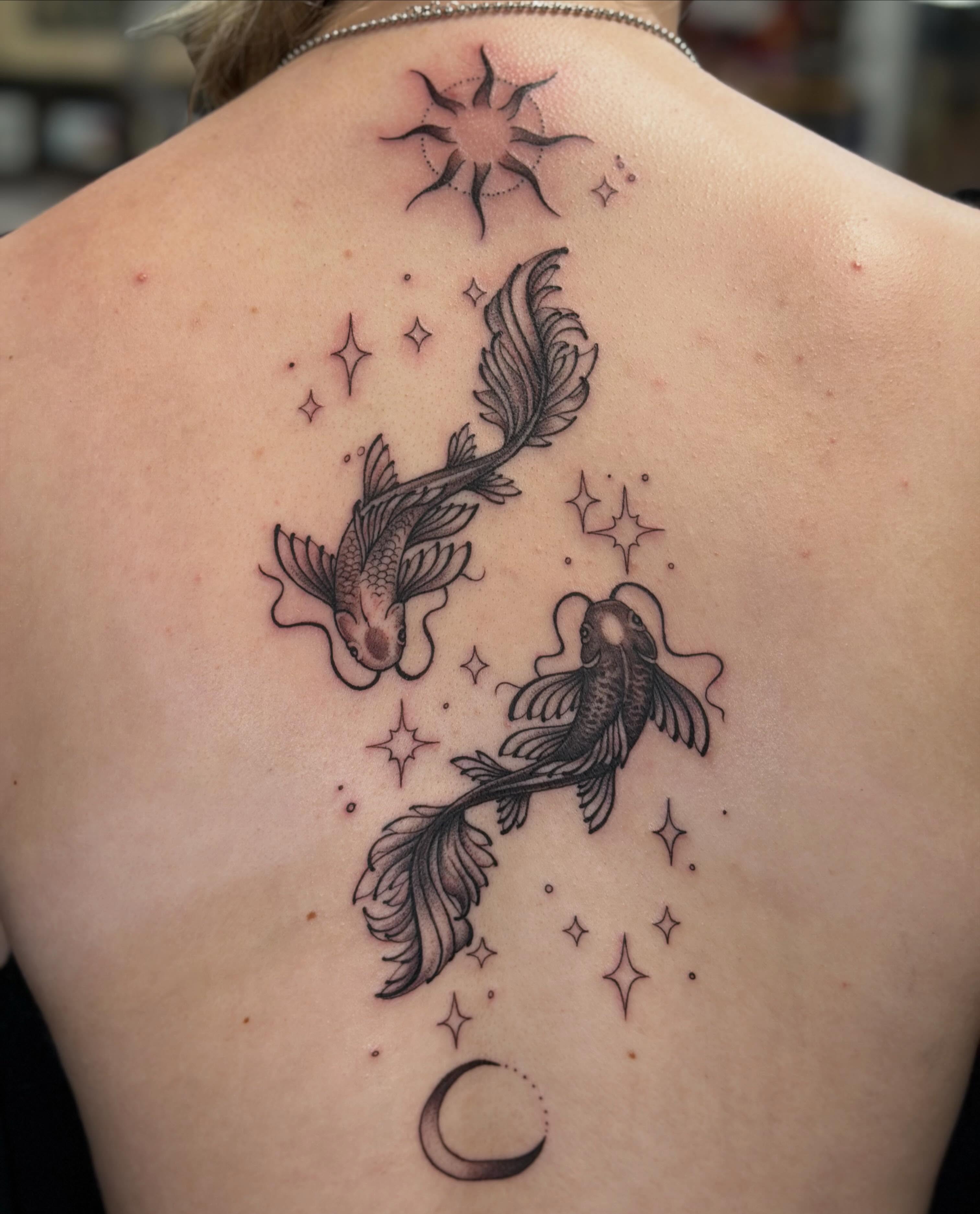 Koi fish and stars black and grey tattoo on the back by Trista Bettfreund (Birdy)