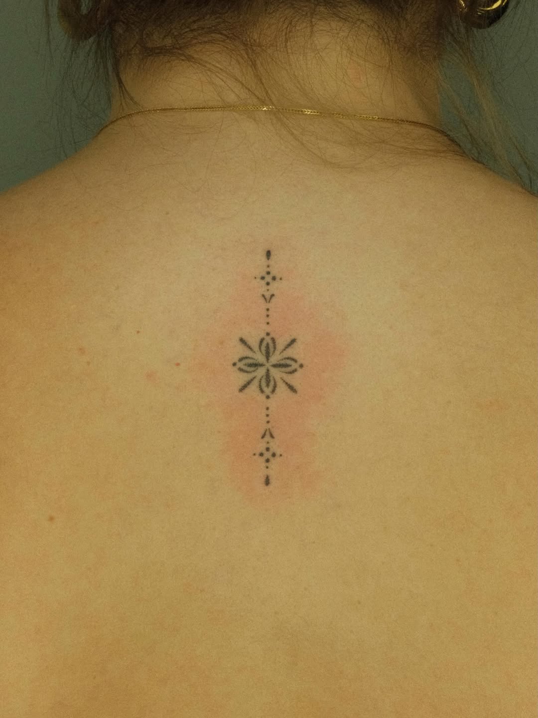 Geometric floral ornament dotwork tattoo on the back by Thiên Hồ