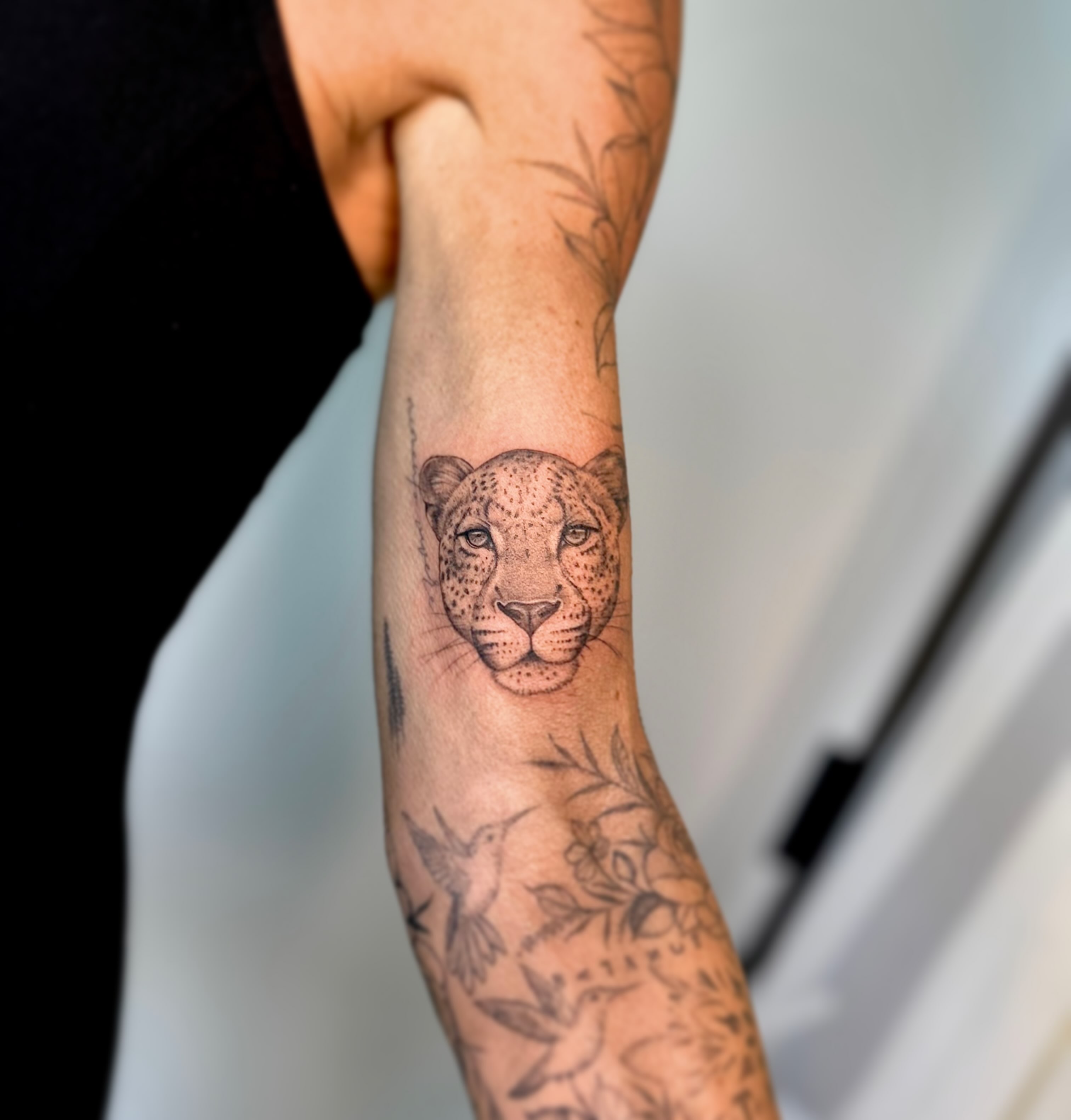 Leopard head dotwork tattoo on the forearm by L i v π Tattoo Artist. AMITY TATTOO