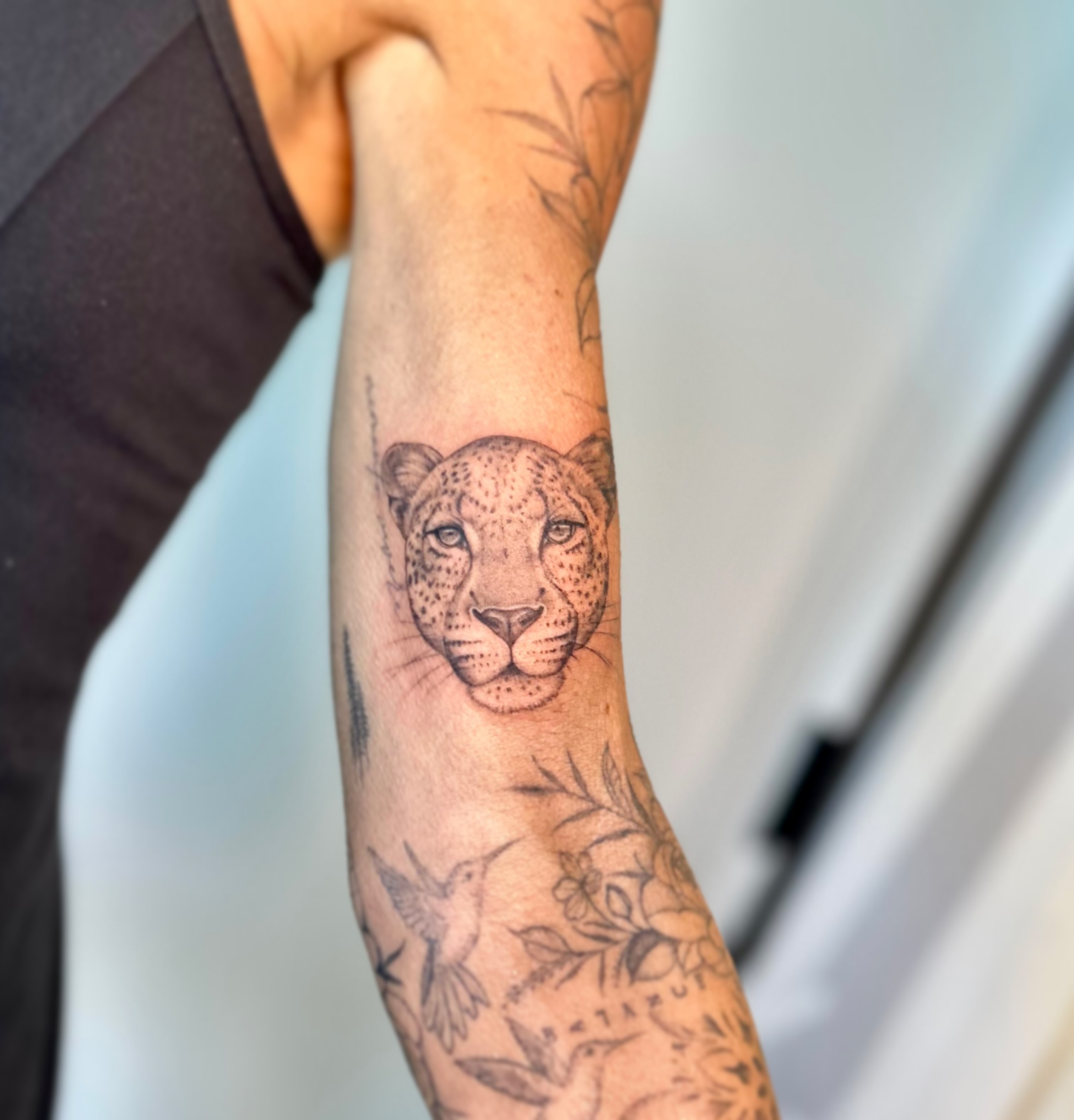 Leopard head black and grey tattoo on the forearm by L i v π Tattoo Artist. AMITY TATTOO