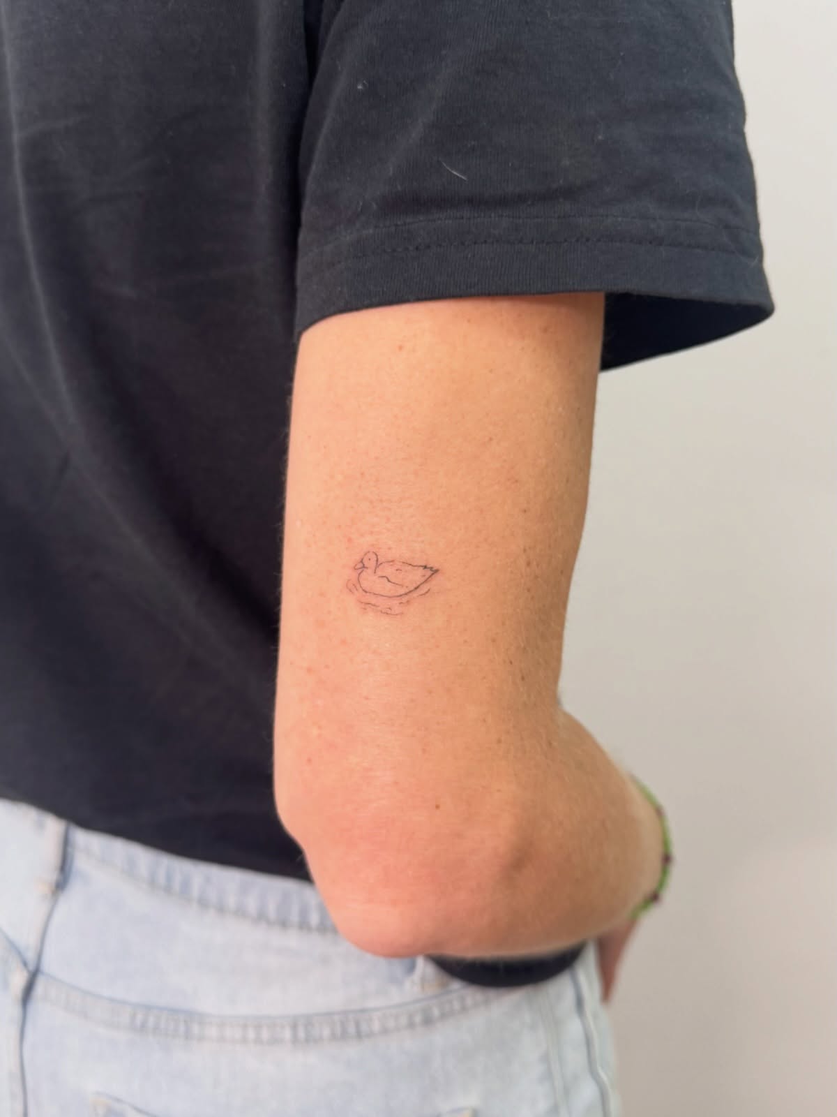 Duck minimalist tattoo on the forearm by Nicole
