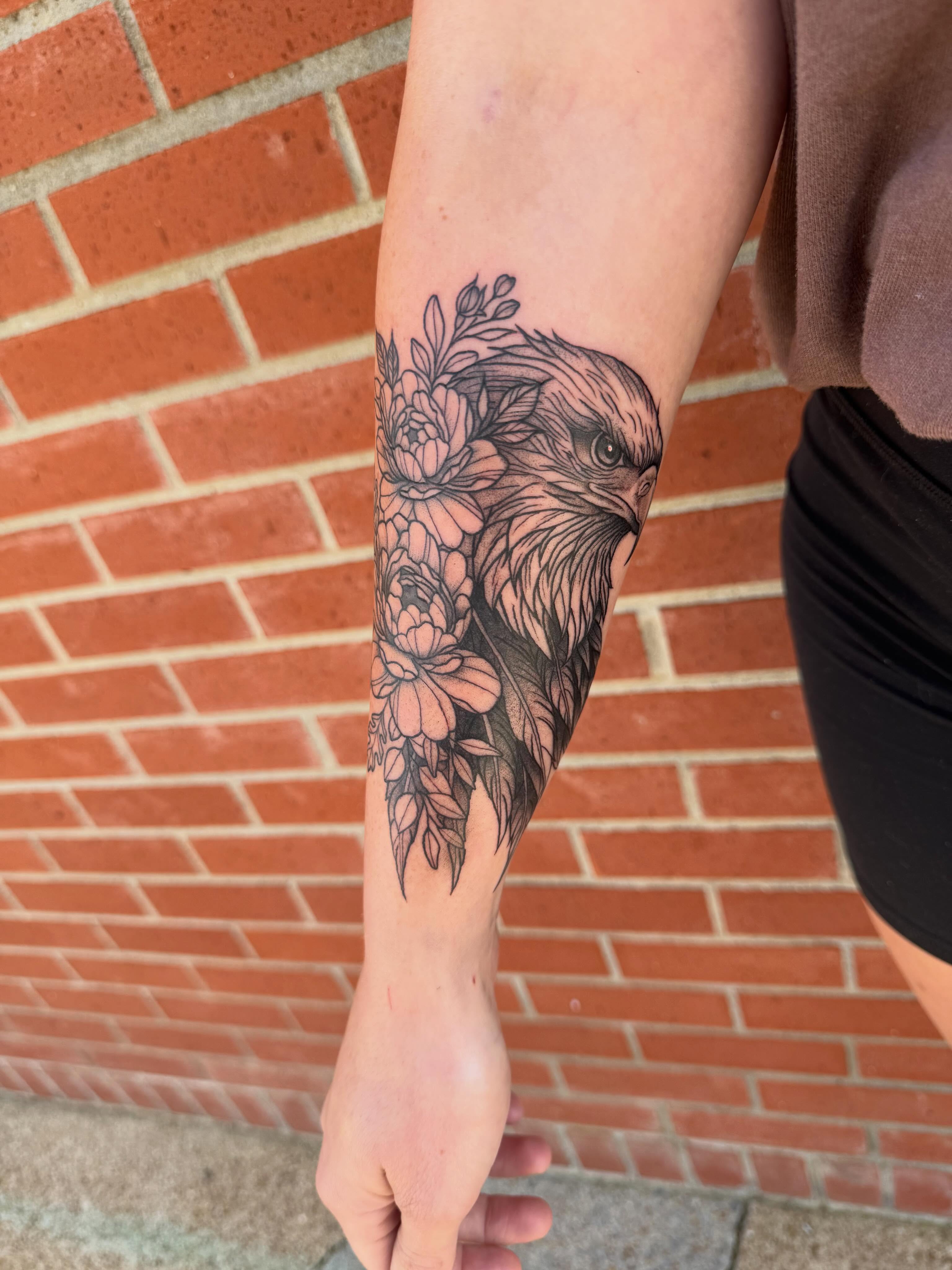 Hawk and flowers black and grey tattoo on the forearm by Aly Rucker, Murfreesboro, Tennessee