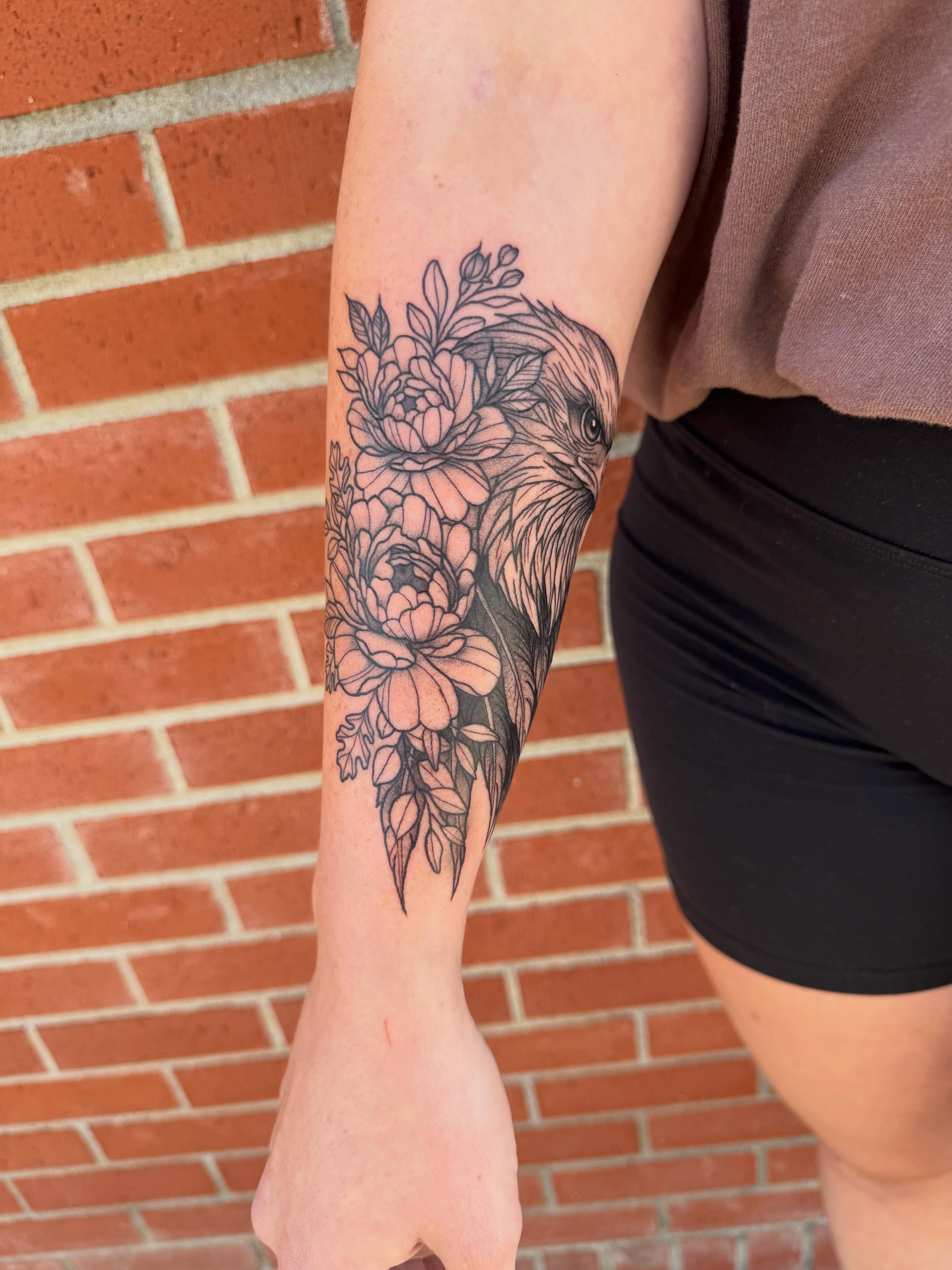 Bird and floral realism tattoo on the forearm by Aly Rucker, Murfreesboro, Tennessee