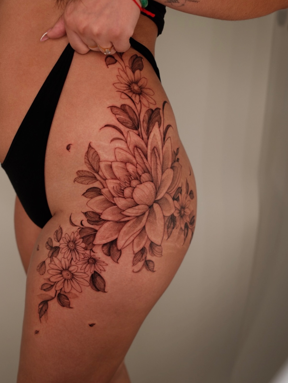 Floral bouquet realism tattoo on the thigh by LORIE π€ Floral Tattoo Artist, Los Angeles, California