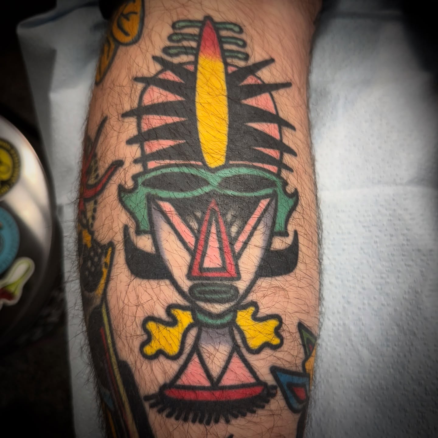 Jester mask American traditional tattoo on the forearm by Chuck Paprocki, Nashville, Tennessee