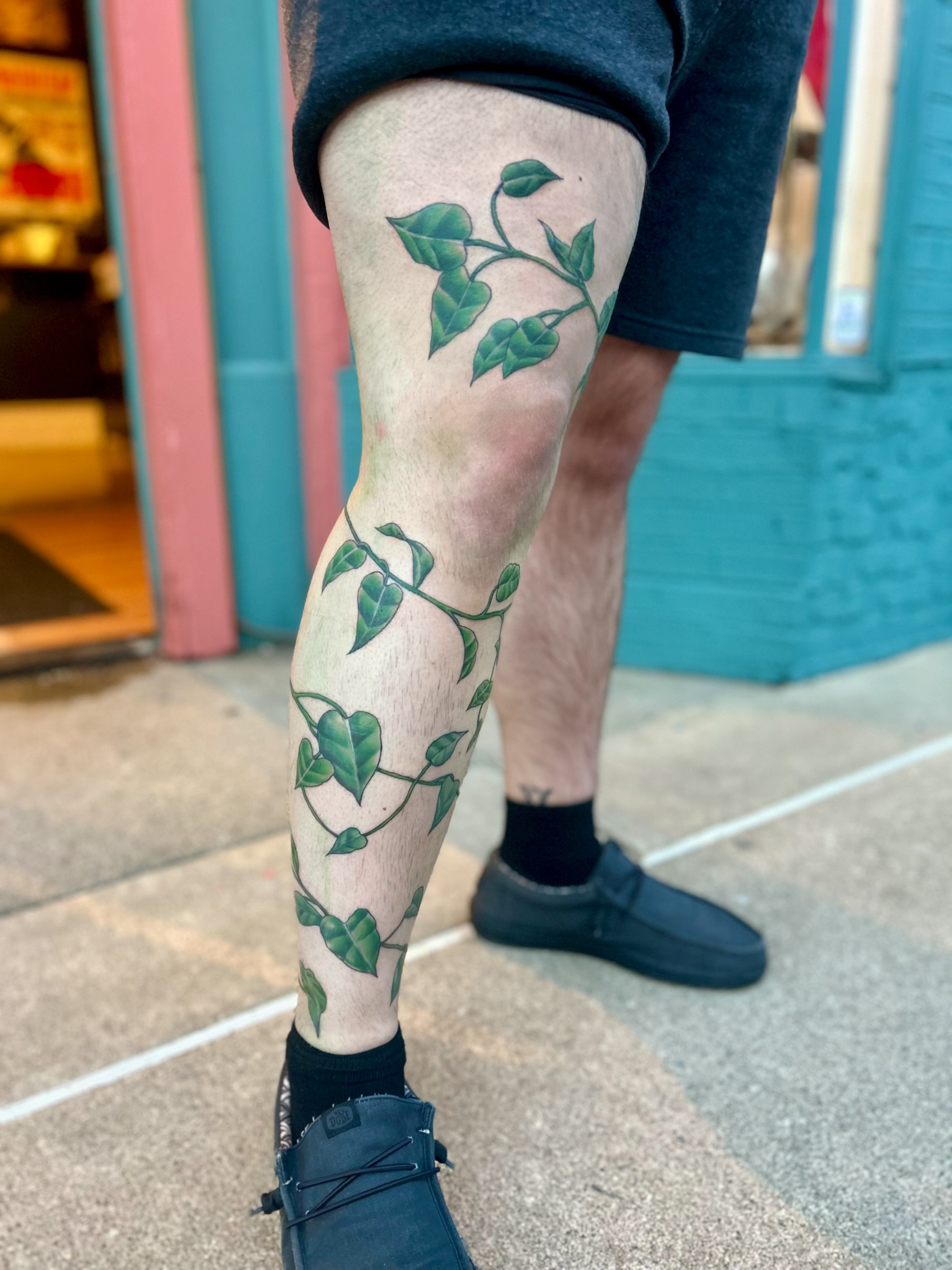 Ivy vine realism tattoo on the calf by Tori Magill