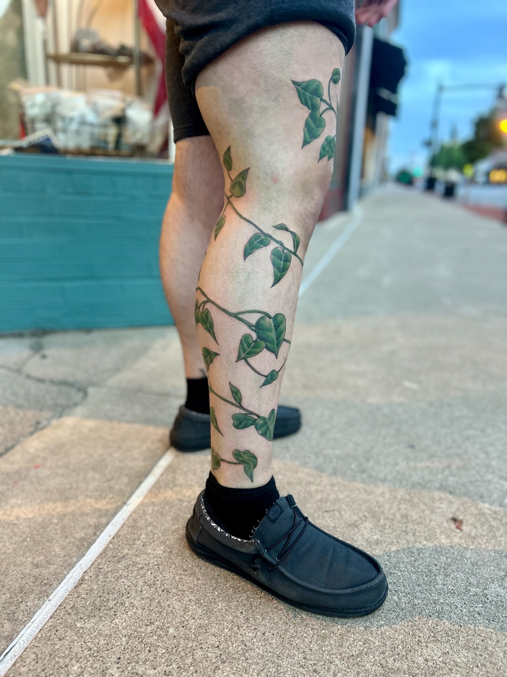 Ivy vines dotwork tattoo on the calf by Tori Magill