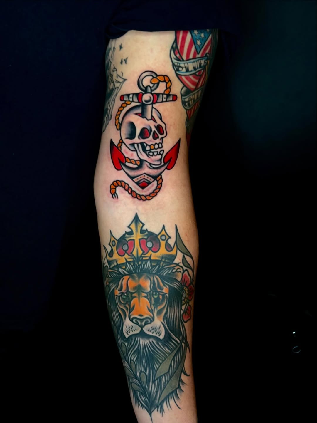 Skull and anchor, lion with crown American traditional tattoo on the forearm by Sergio meza