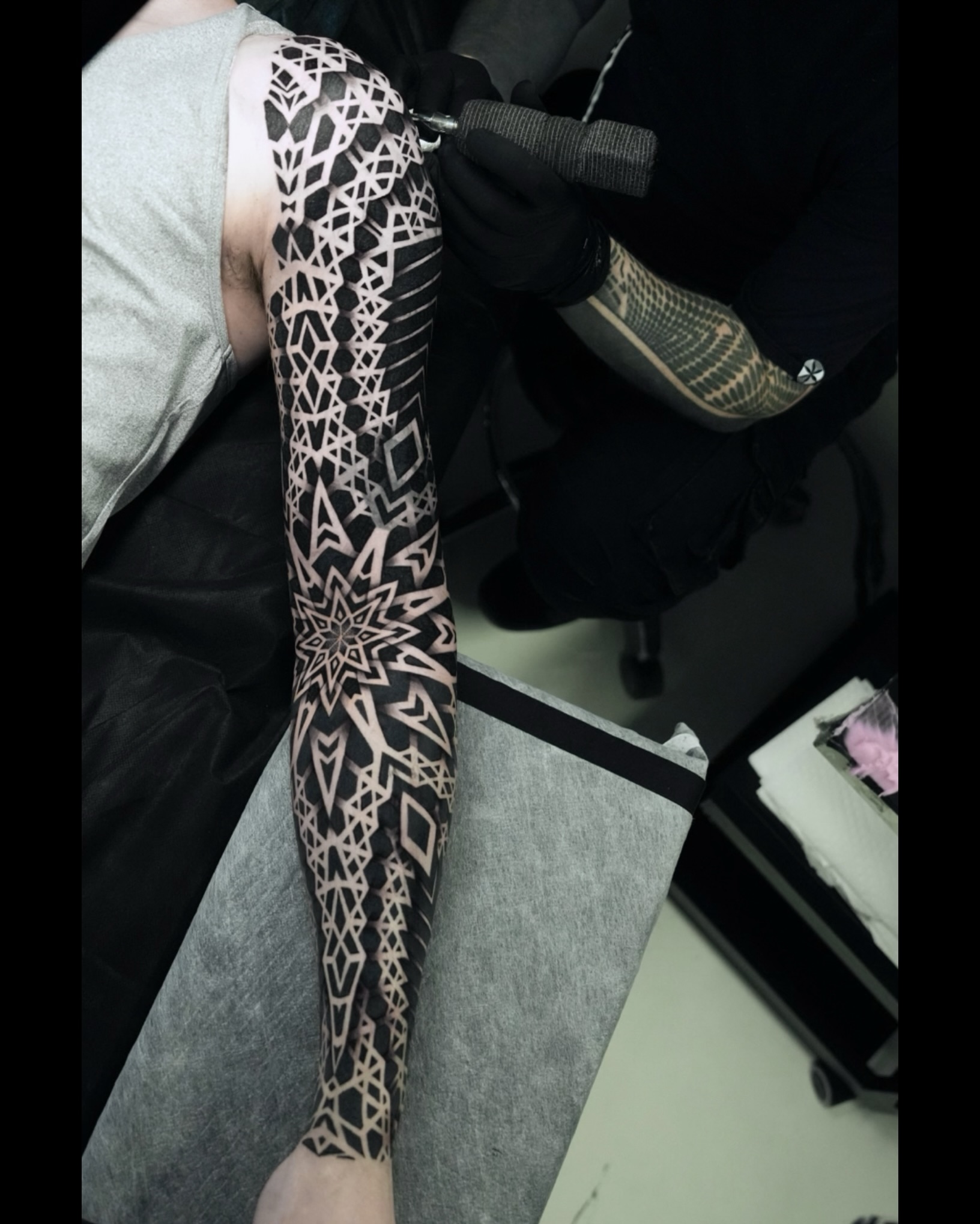Geometric pattern sleeve geometric tattoo on the forearm by Ilya Cascad Kandaurov