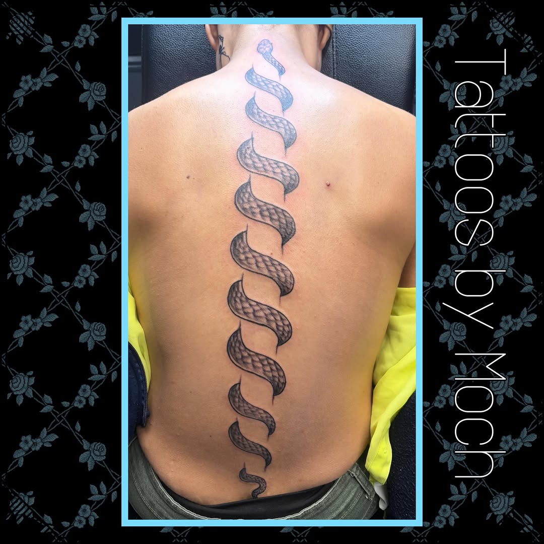 Snake down spine tattoo on the back by Tattoos By Moch, Toledo, Ohio