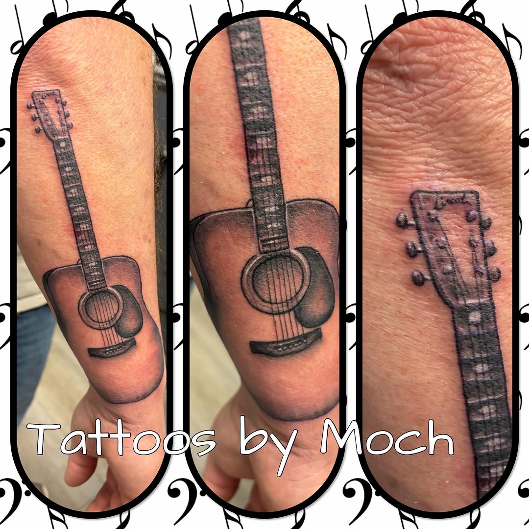 Acoustic guitar tattoo on the forearm by Tattoos By Moch, Toledo, Ohio