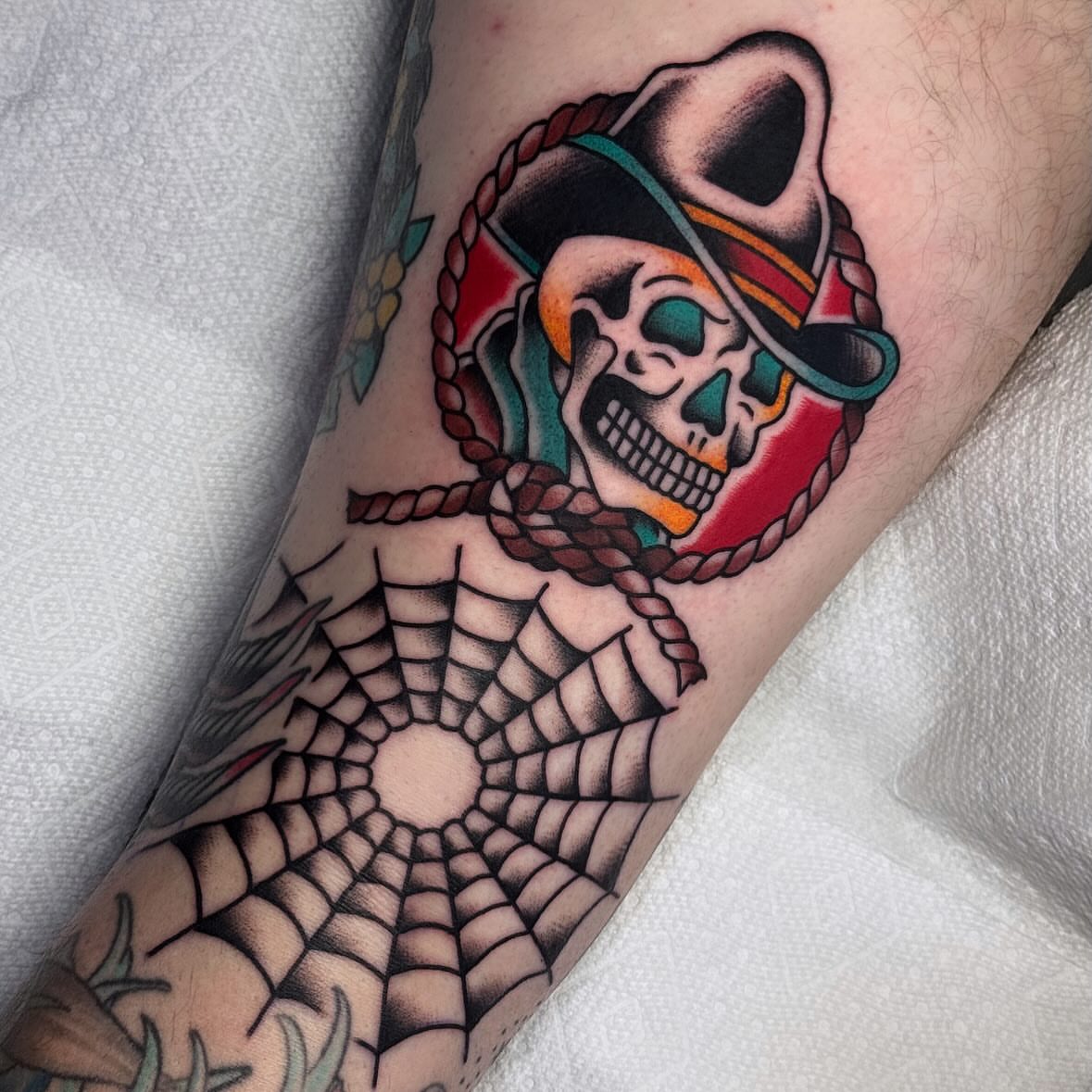 Skull wearing pirate hat American traditional tattoo on the forearm by Larry Love