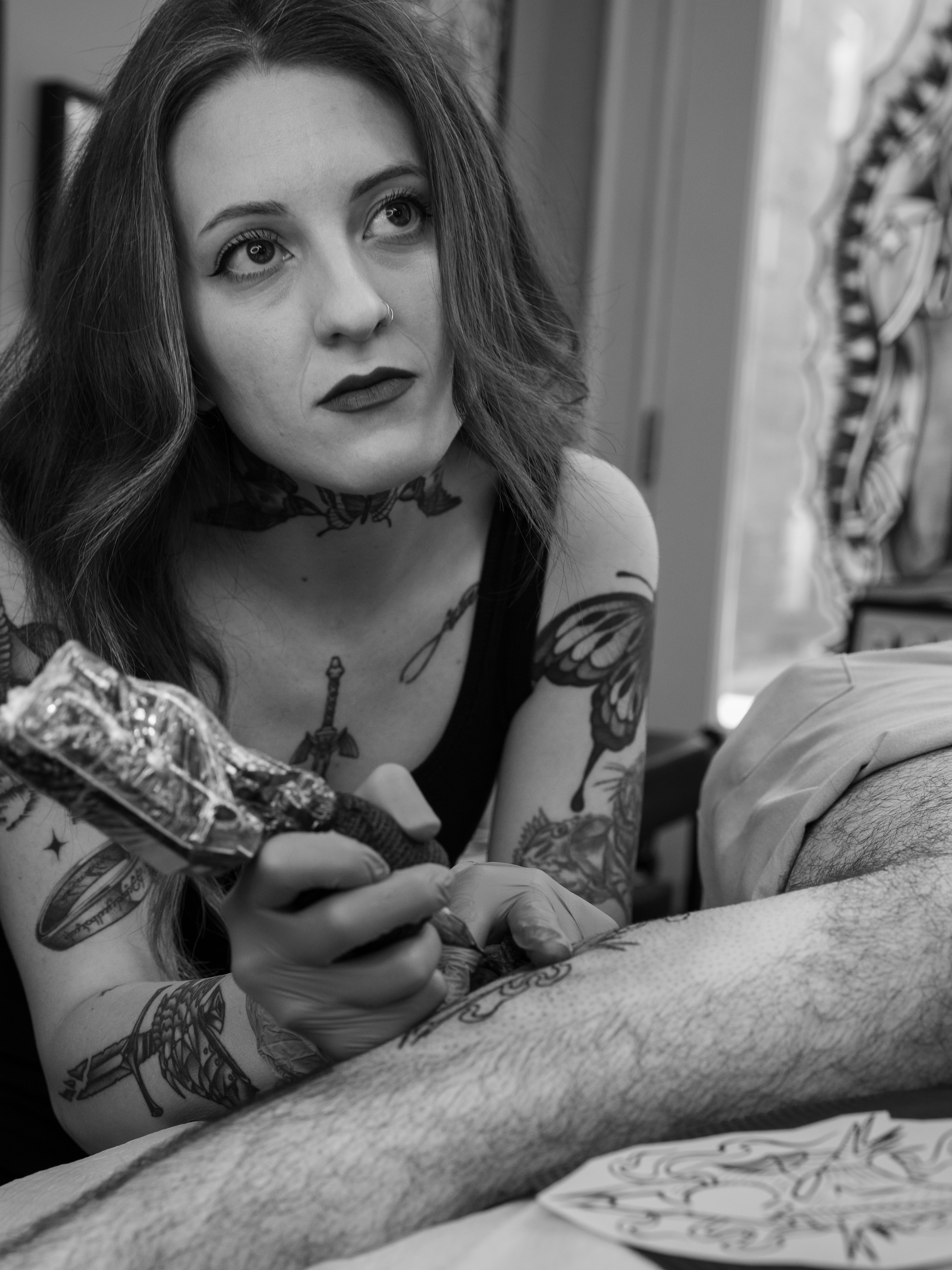 Butterfly black and grey tattoo on the upper arm by Harlee Hornsby