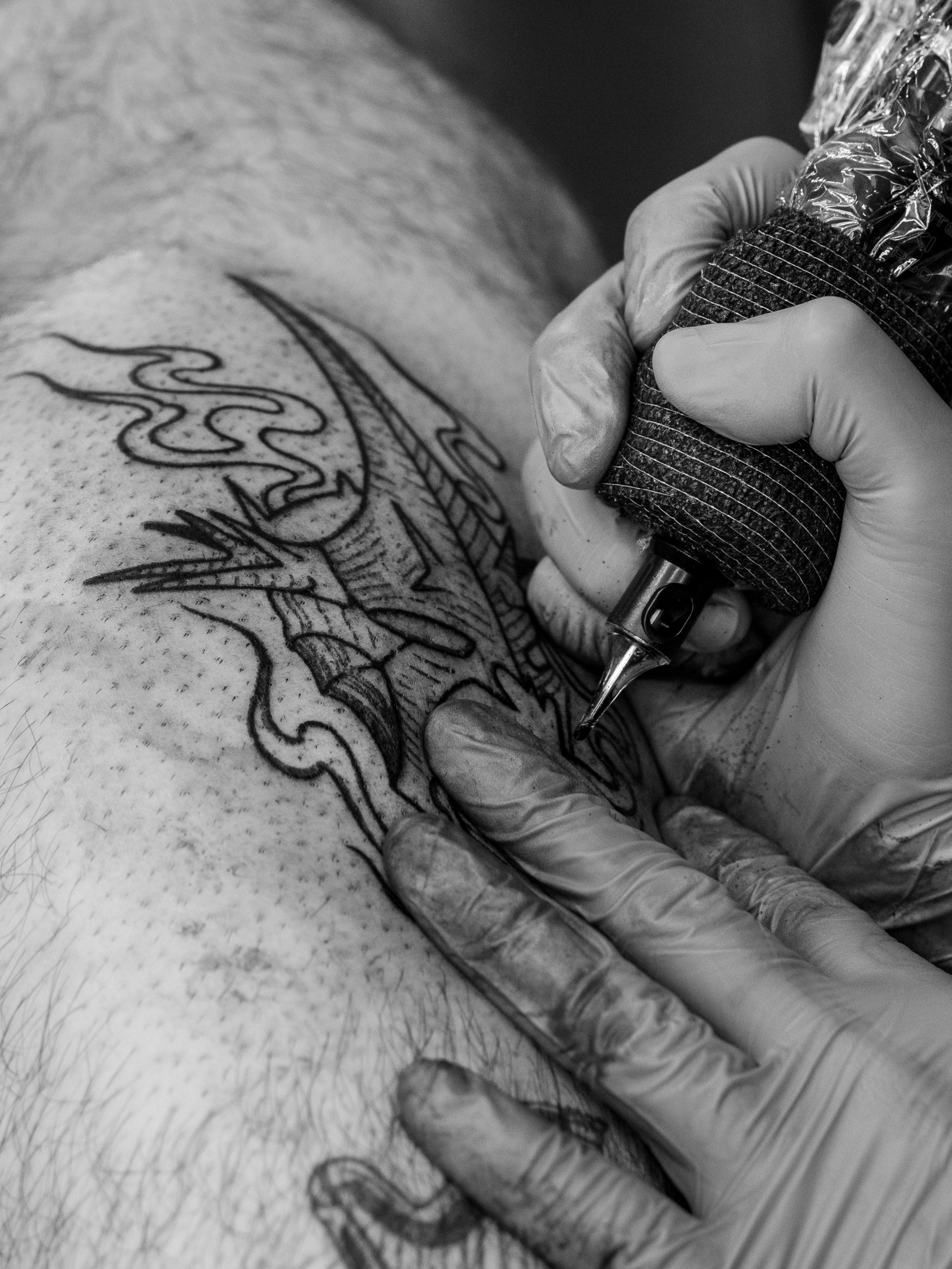Bird black and grey tattoo on the thigh by Harlee Hornsby