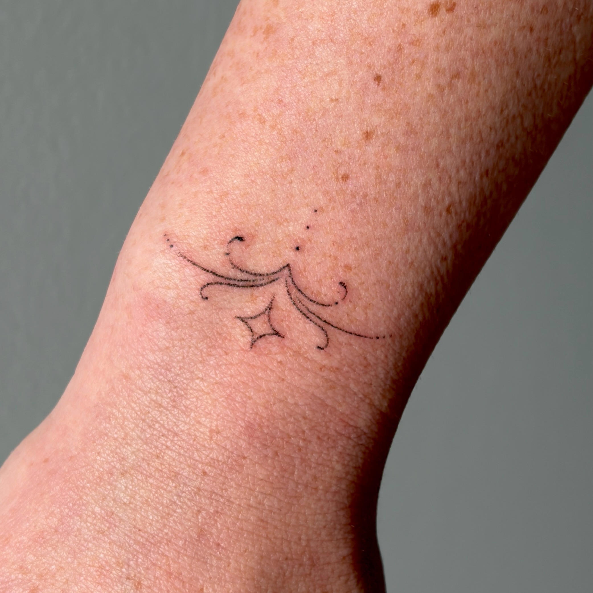 Floral design fine line tattoo on the forearm by alli ミ☆