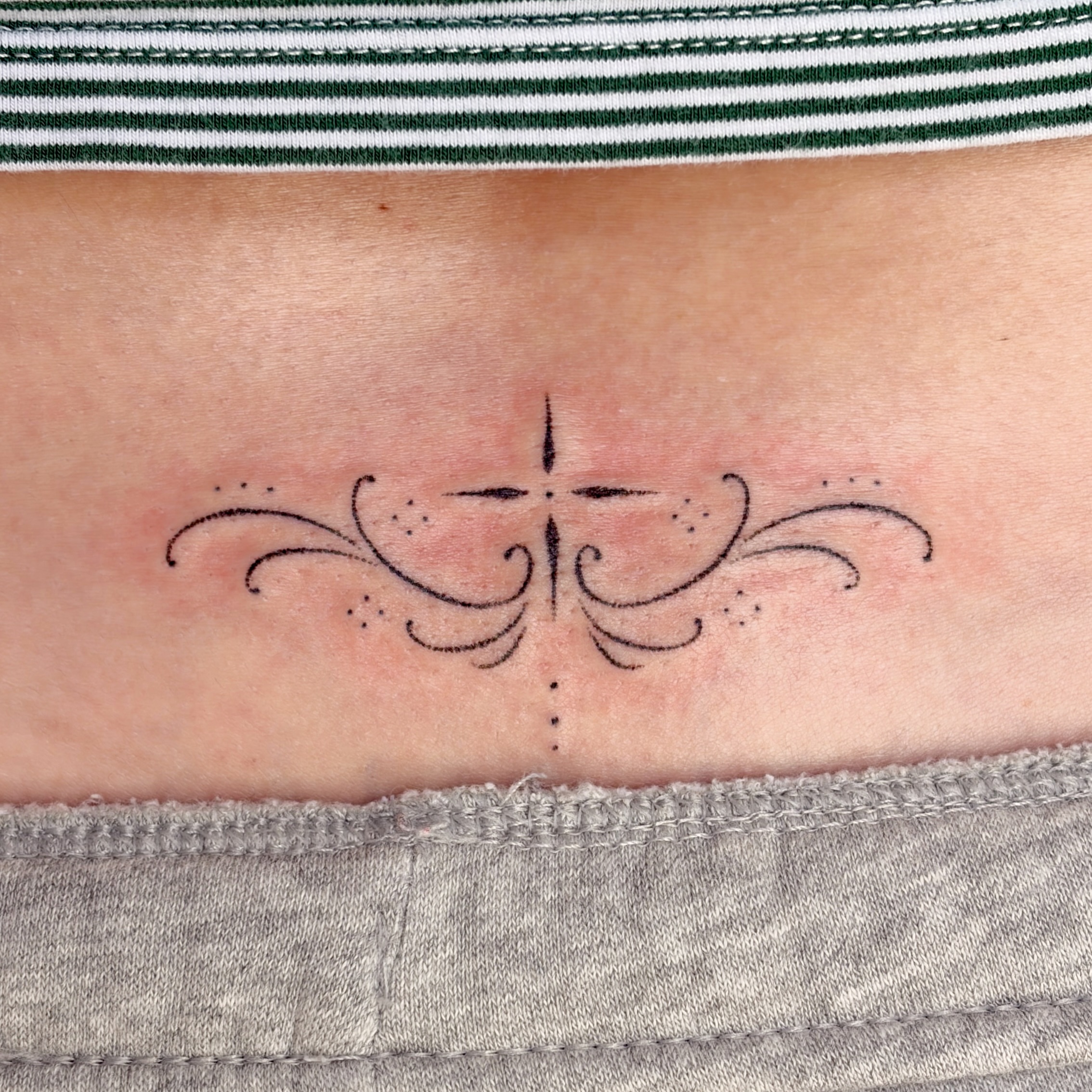 Cross with flourishes geometric tattoo on the forearm by alli ミ☆