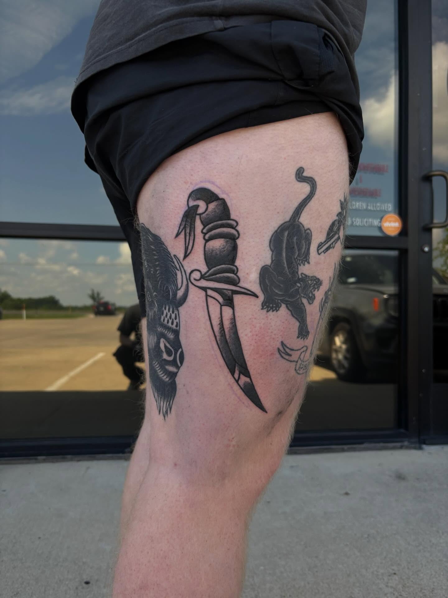 Knife and animal black and grey tattoo on the thigh by Ethan Ellis, Dallas, Texas