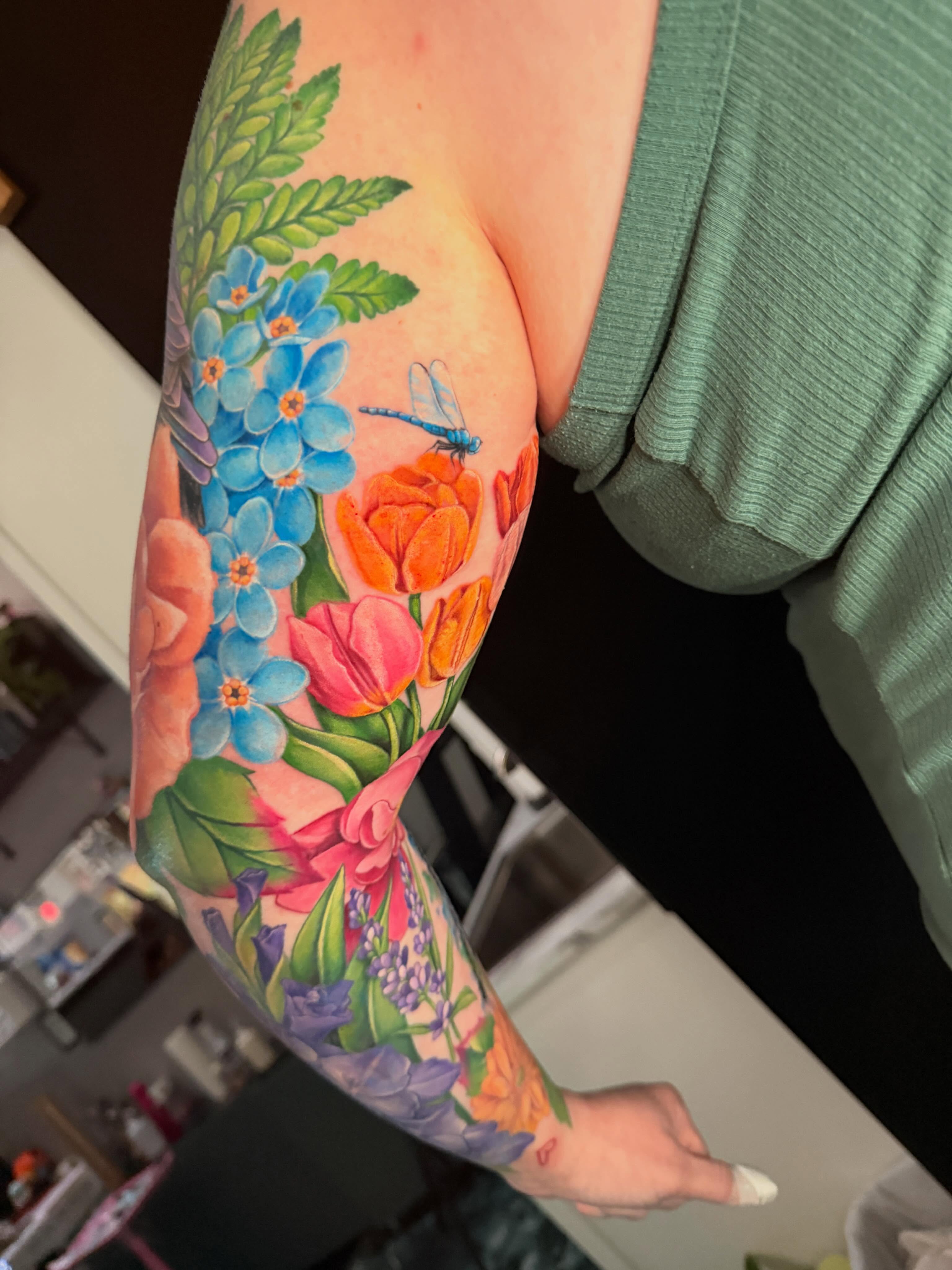 Floral bouquet realism tattoo on the forearm by Violet Michelle Williams, Charlotte, North Carolina