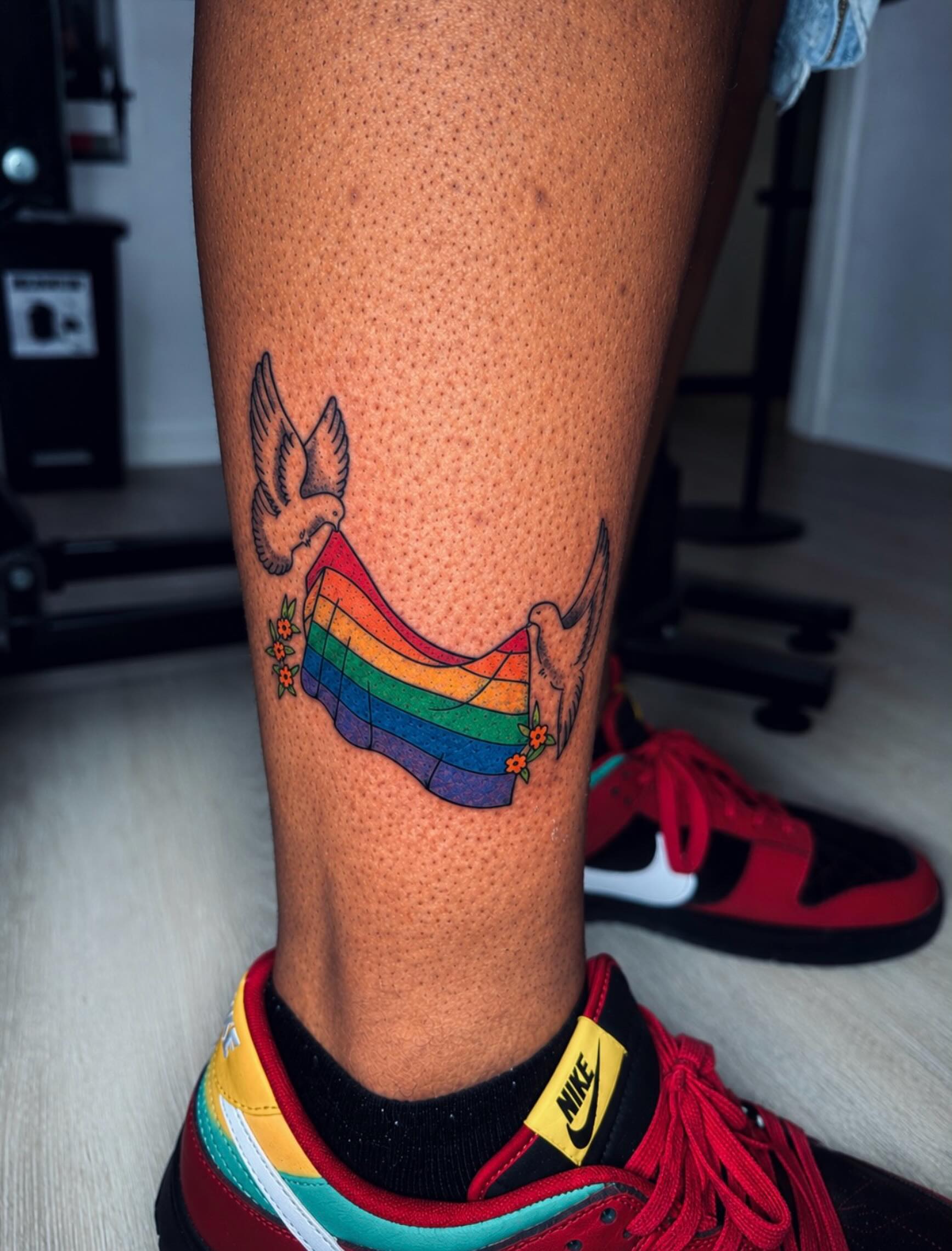 Rainbow hammock new school tattoo on the calf by Kelsoink