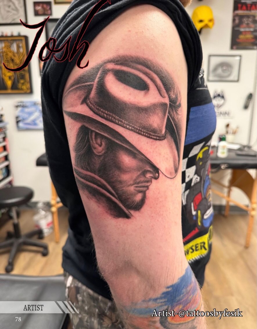 Man wearing a helmet realism tattoo on the forearm by Tattoos by Fesik LLC