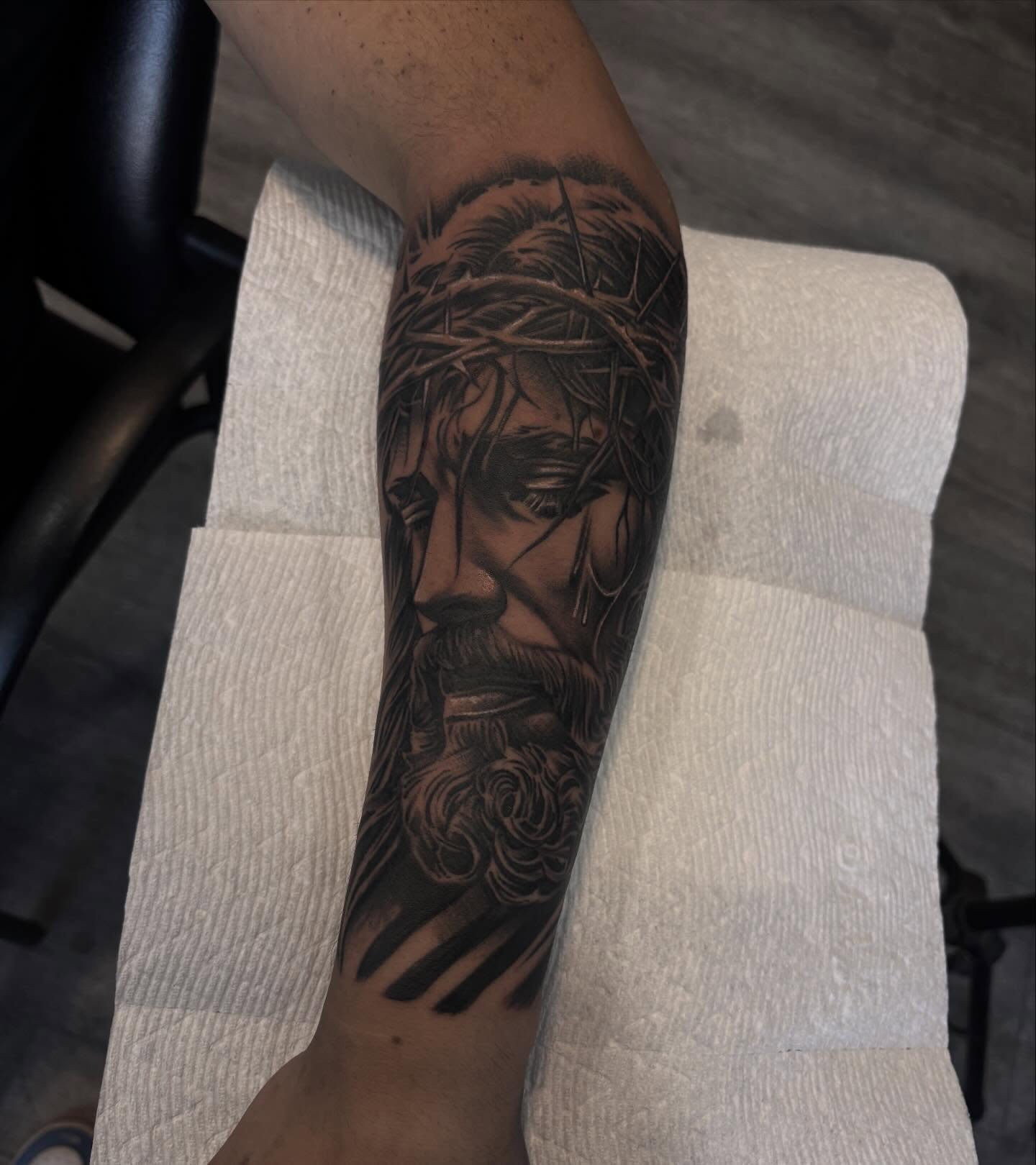 Religious figure realism tattoo on the forearm by michael
