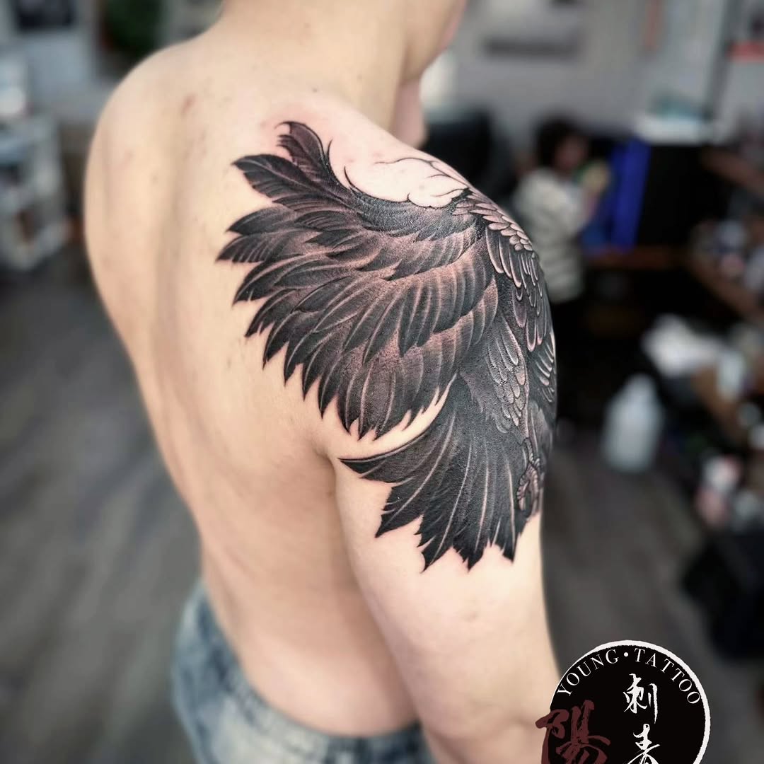 Eagle wing realism tattoo on the shoulder by Ying