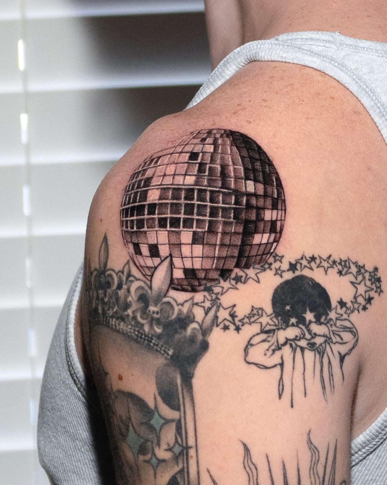 Disco ball black and grey tattoo on the shoulder by Danny Pando