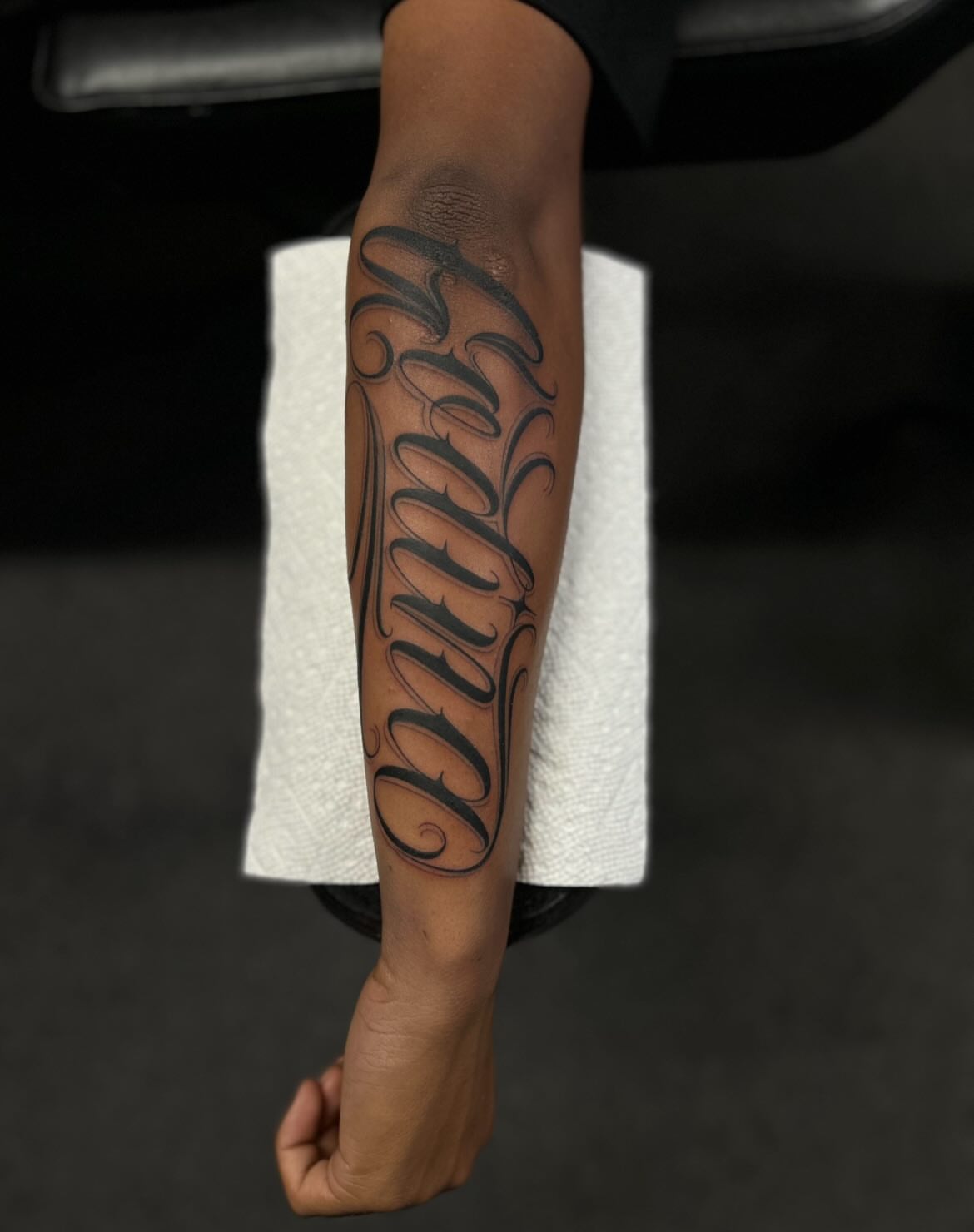 Script lettering lettering script tattoo on the forearm by Tattoo Artist