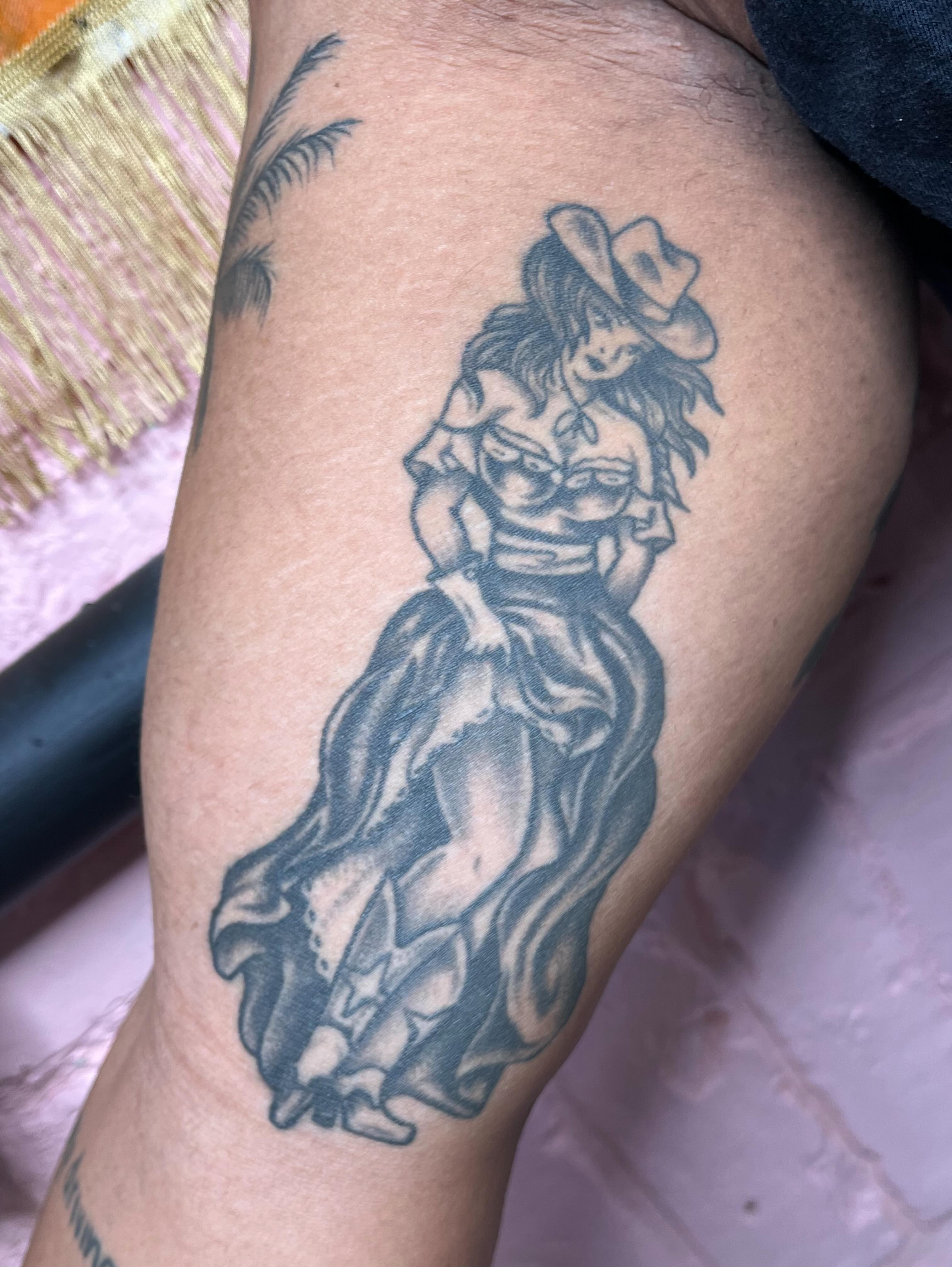 Woman with hat black and grey tattoo on the thigh by ✨ Chris ✨