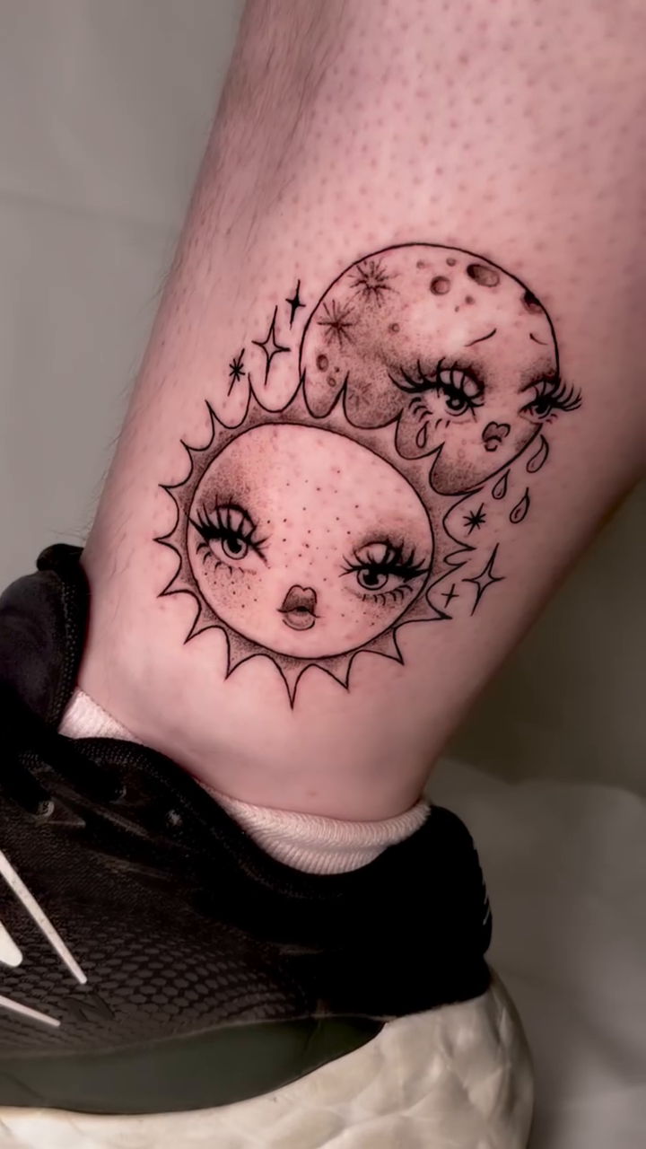 Sun and moon faces new school tattoo on the leg by tattooz by megz