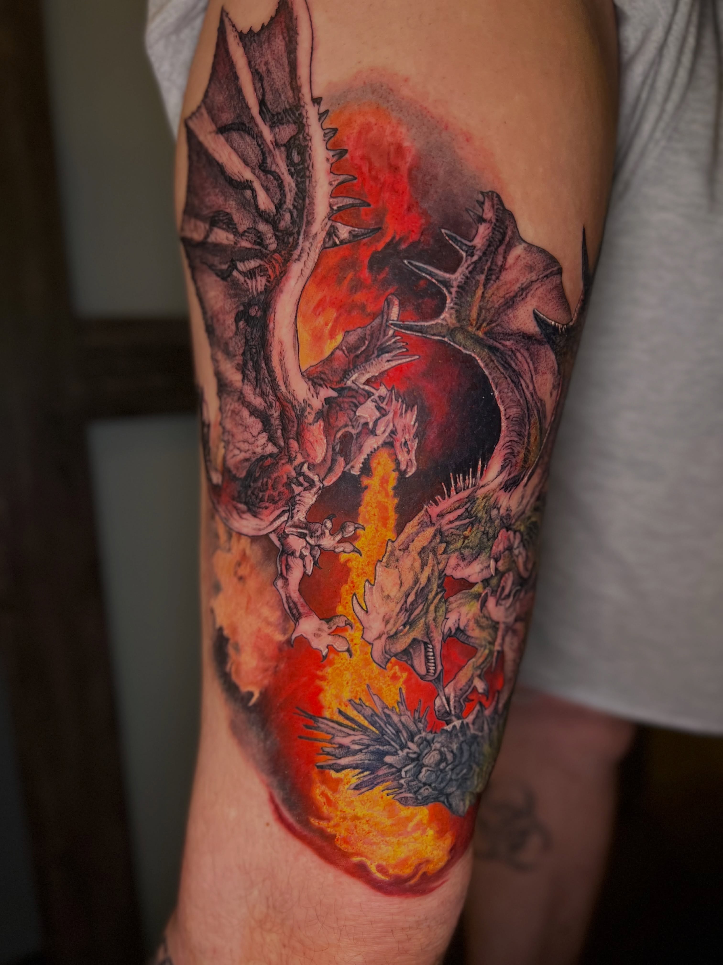 Dragons and flames realism tattoo on the forearm by Dominick Cali, East Islip, New York