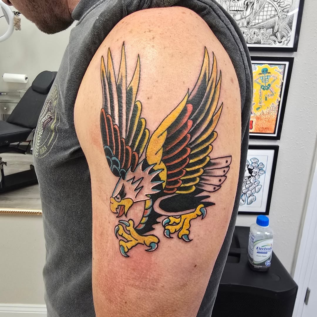 Eagle American traditional tattoo on the shoulder by Captain Michael Devious