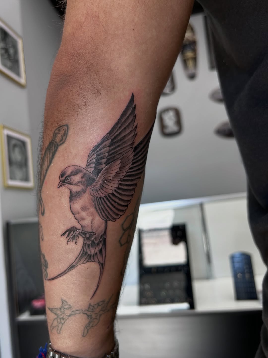 Swallow bird fine line tattoo on the forearm by Oto_art