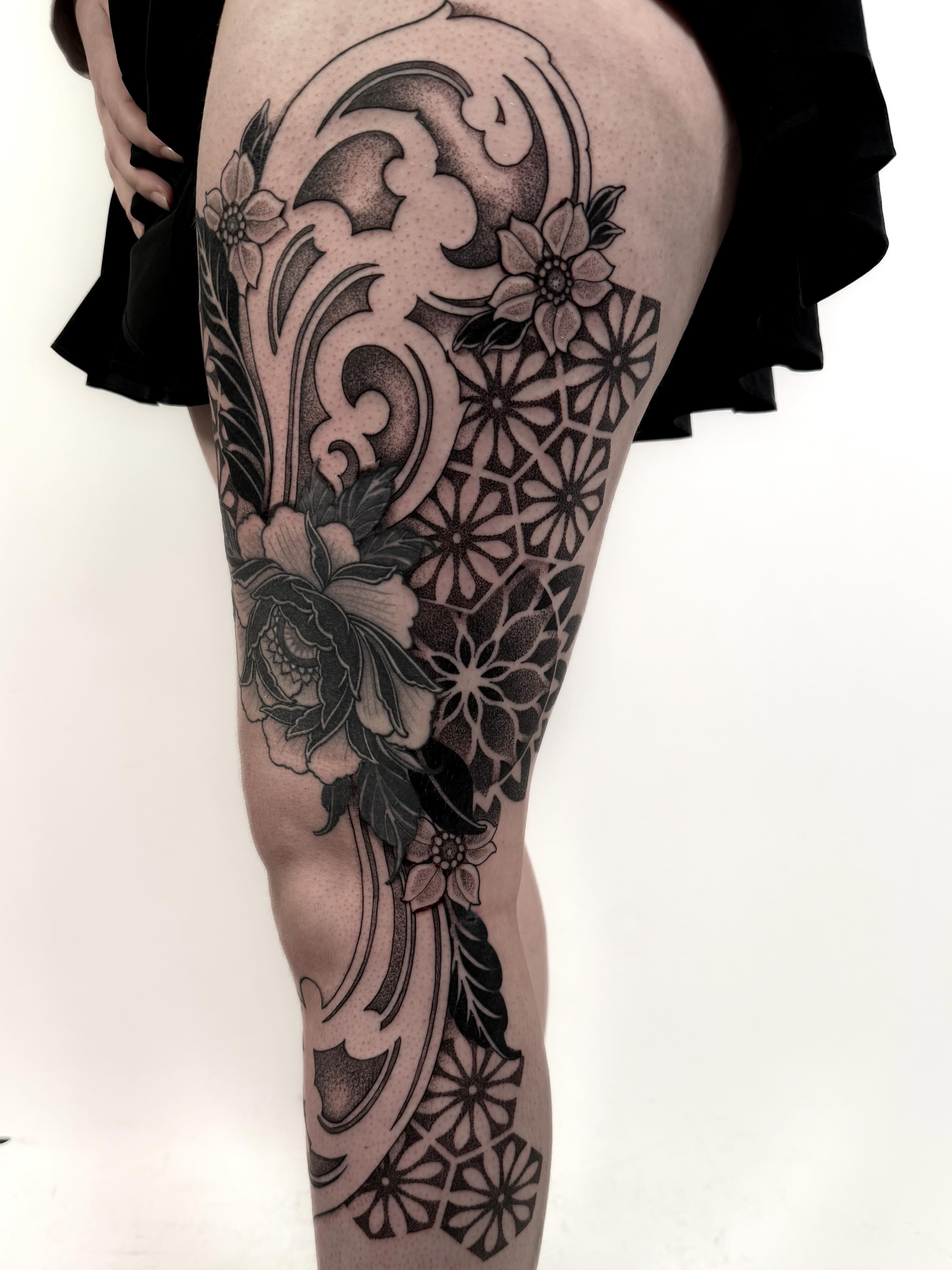 Floral and geometric design dotwork tattoo on the thigh by Jamie Beach, Wheat Ridge, Colorado