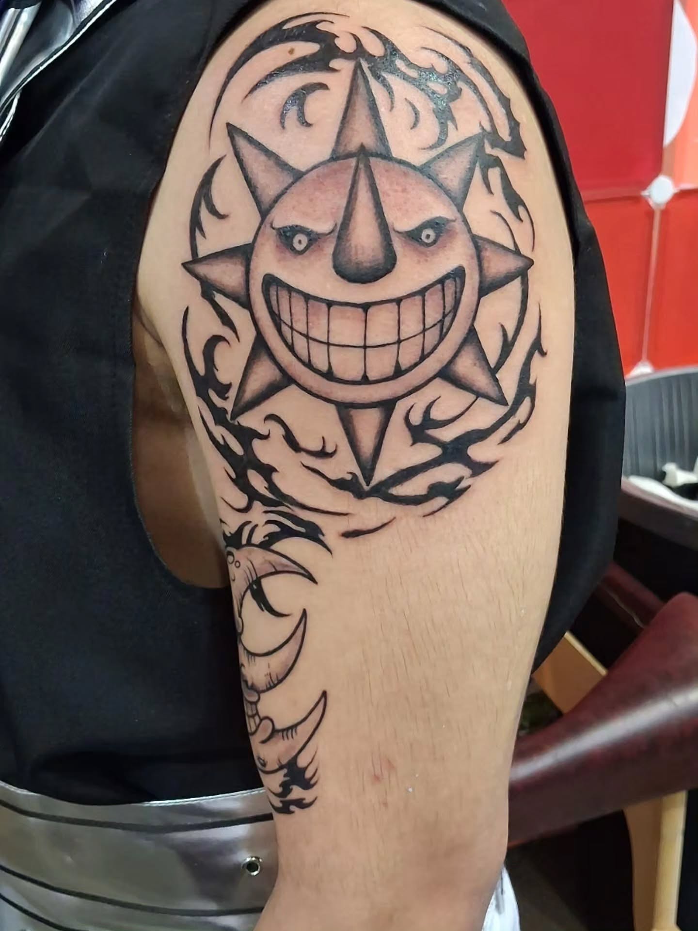 Sun tribal tattoo on the shoulder by BeardedMoney