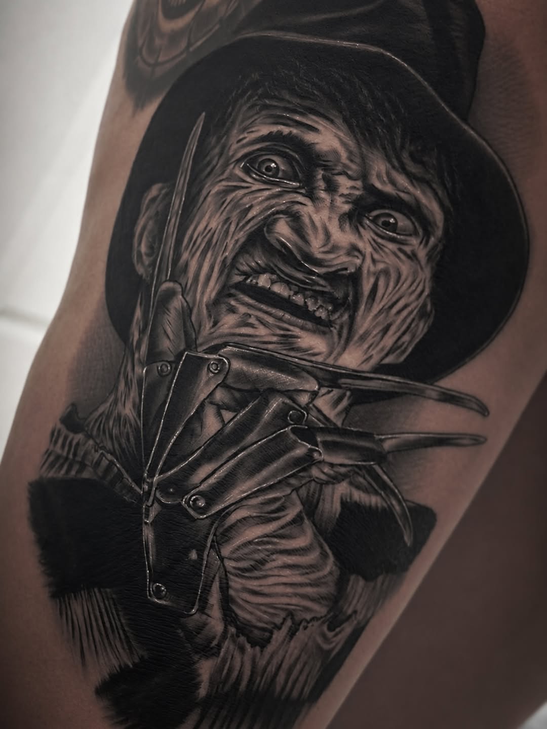 Freddy Krueger portrait realism tattoo on the forearm by ⠀⠀ ⠀ ⠀ ⠀⠀ ⠀⠀ ⠀⠀ ⠀ ⠀⠀ ⠀⠀ᎪᎳᏃ, West Hollywood, California