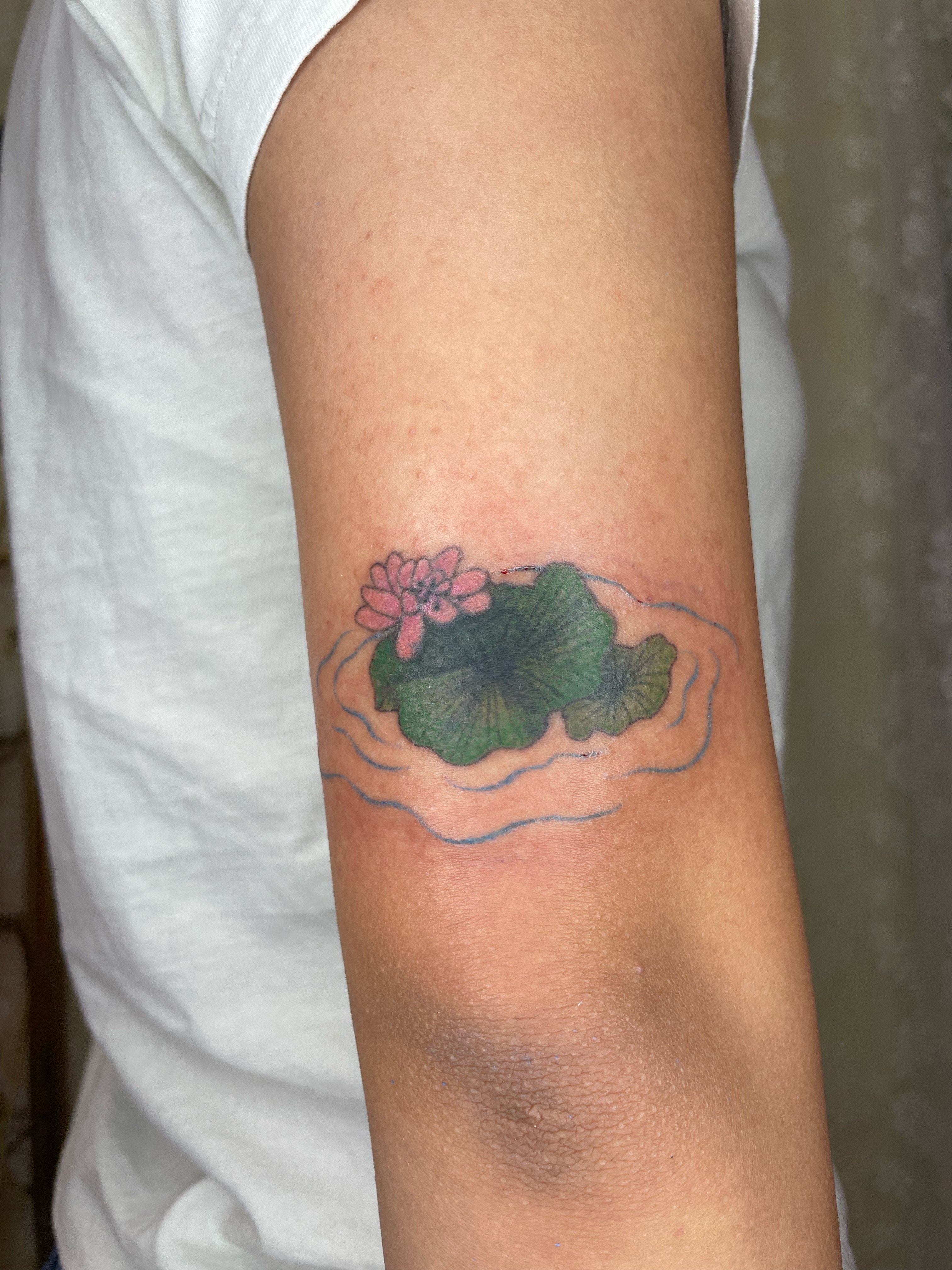 Lotus flower dotwork tattoo on the forearm by cait