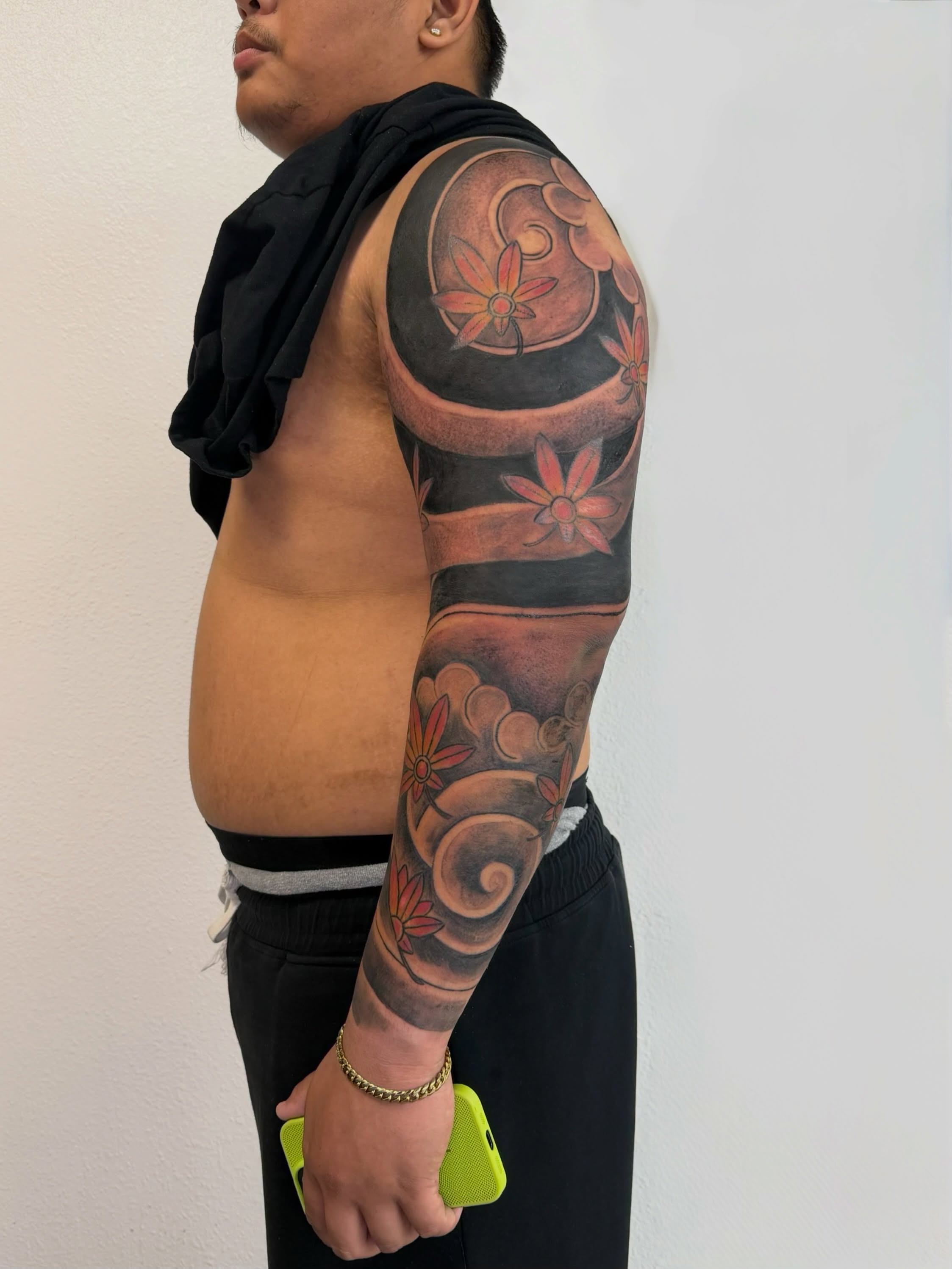 Floral design black and grey tattoo on the upper arm by Caloy Obra