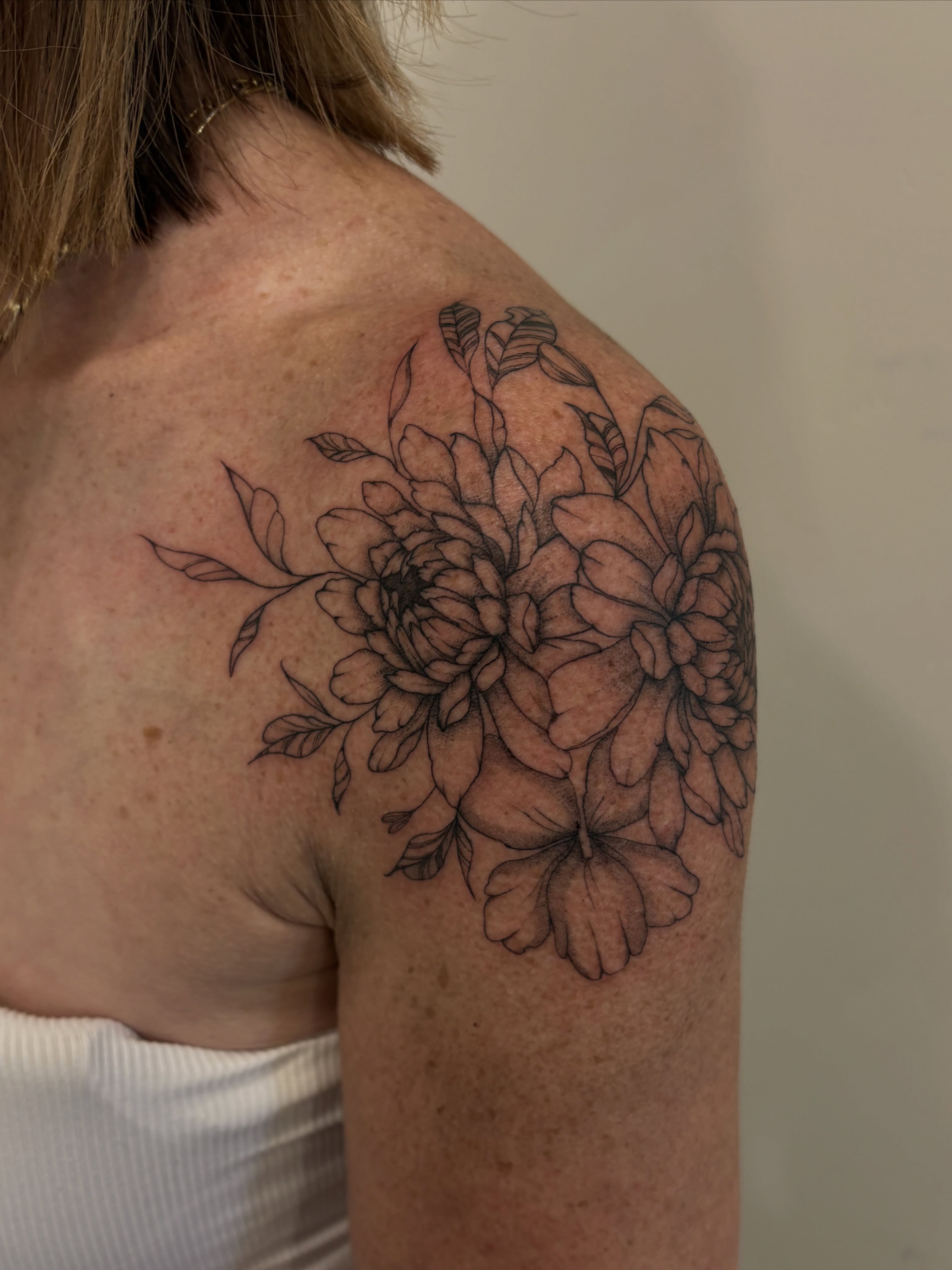 Floral bouquet black and grey tattoo on the shoulder by Tayler, Tooele, Utah