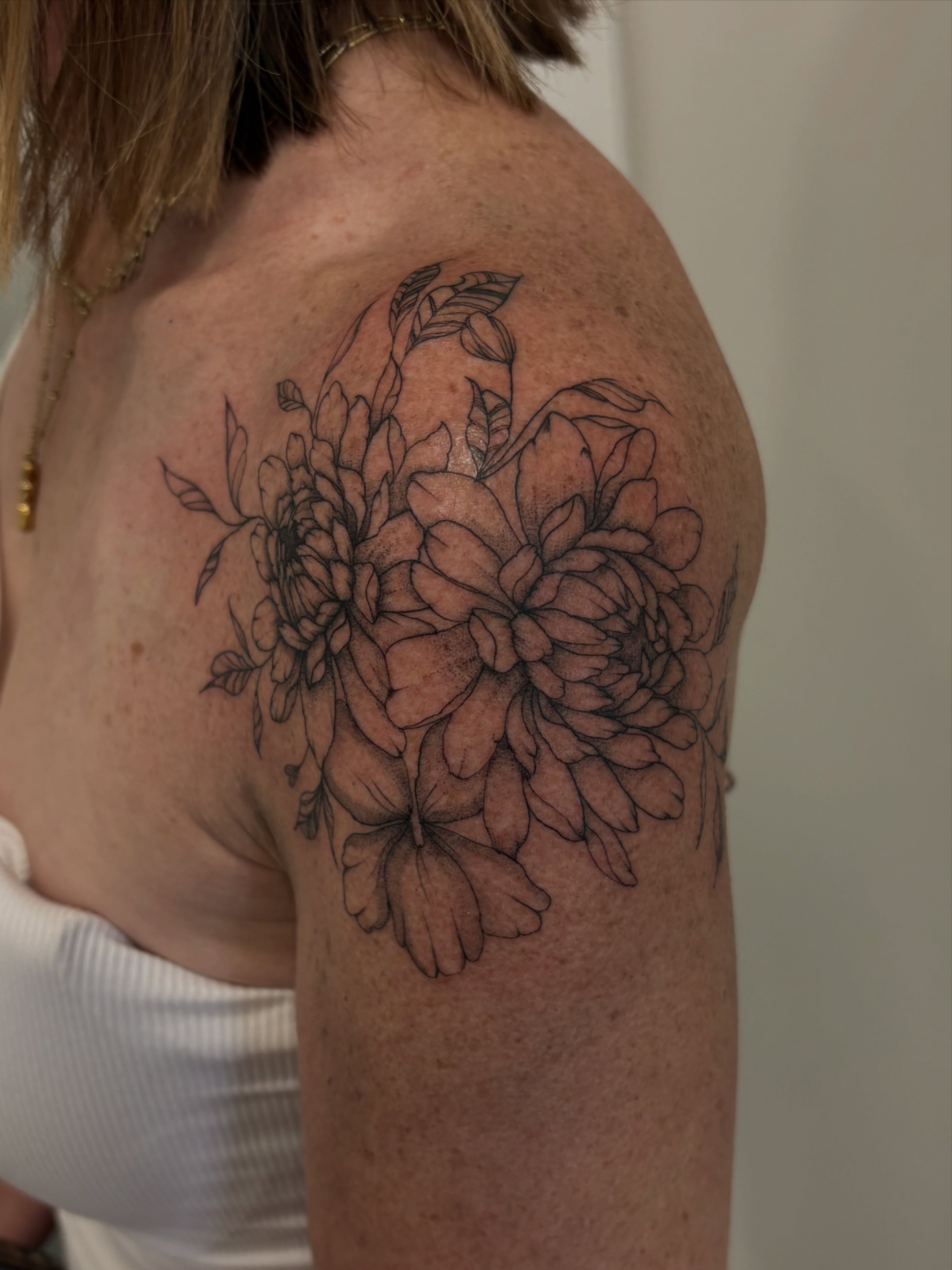 Floral bouquet black and grey tattoo on the shoulder by Tayler, Tooele, Utah