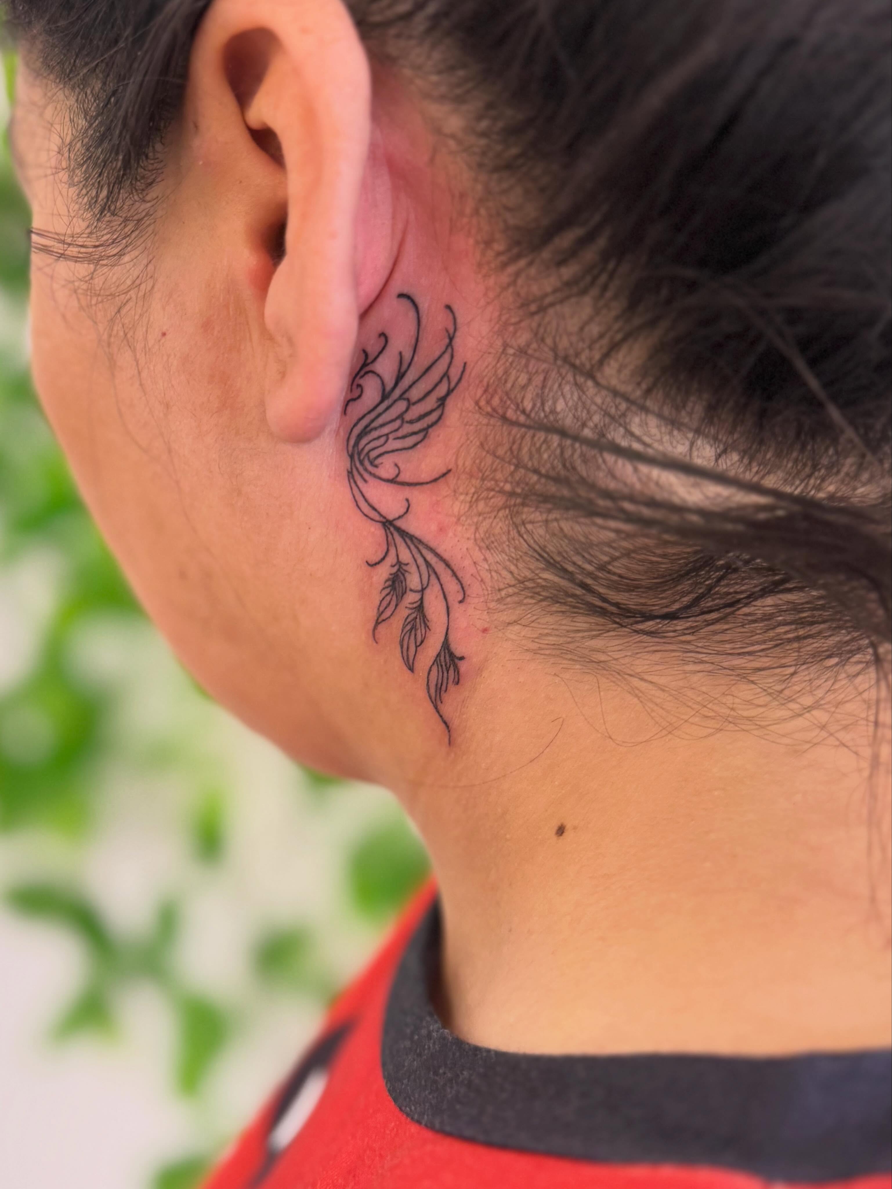 Feather fine line tattoo on the neck by Angela Nery, South Jordan, Utah