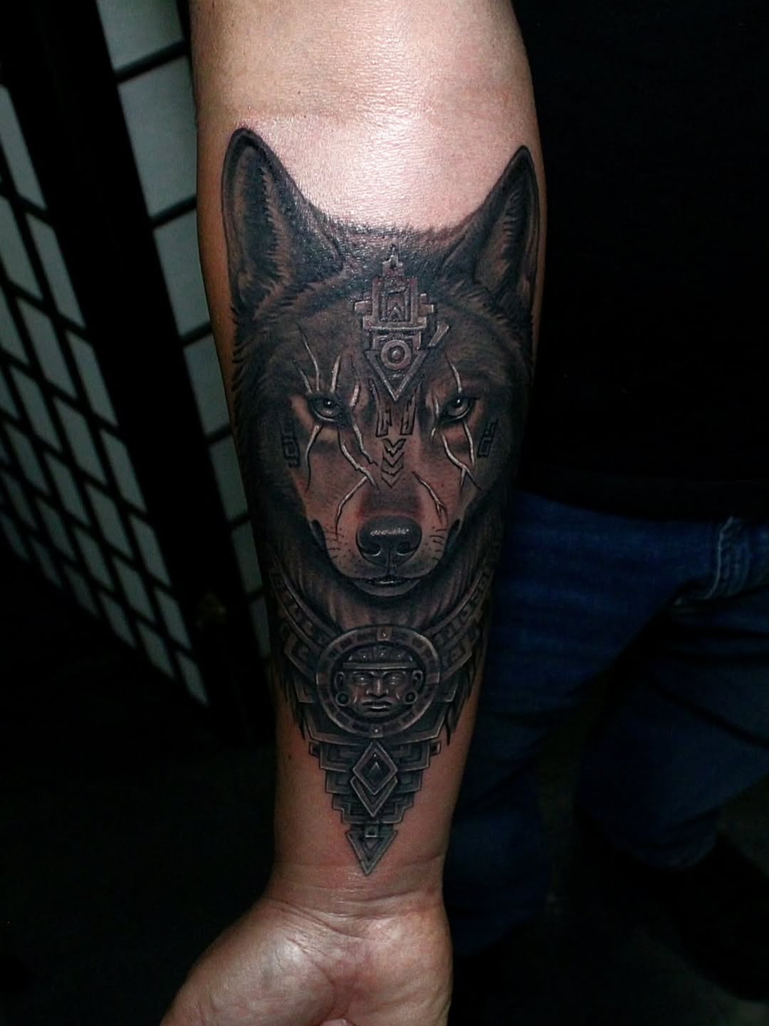 Wolf head with tribal elements realism tattoo on the forearm by Joey Vinci, Phoenix, Arizona