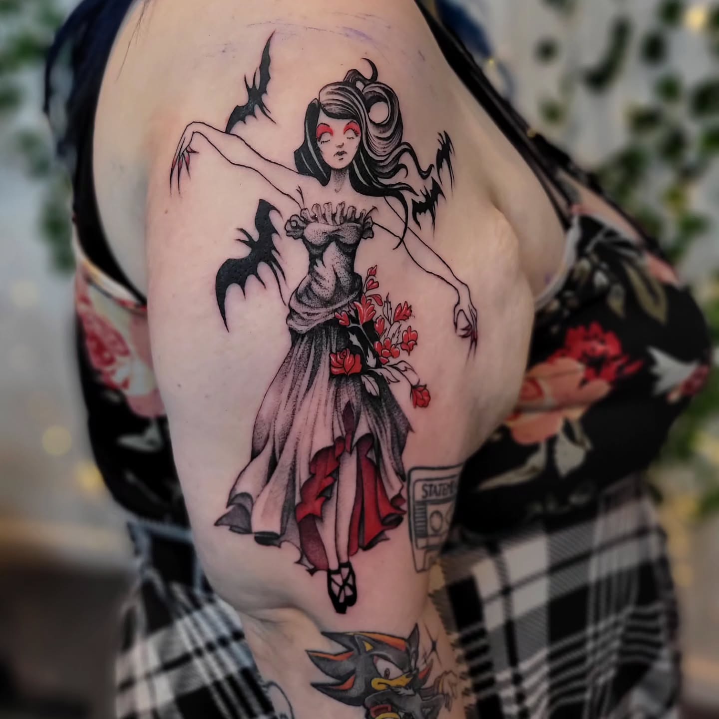 Ballerina with roses American traditional tattoo on the shoulder by Uku Tattoos, Cambridge, England