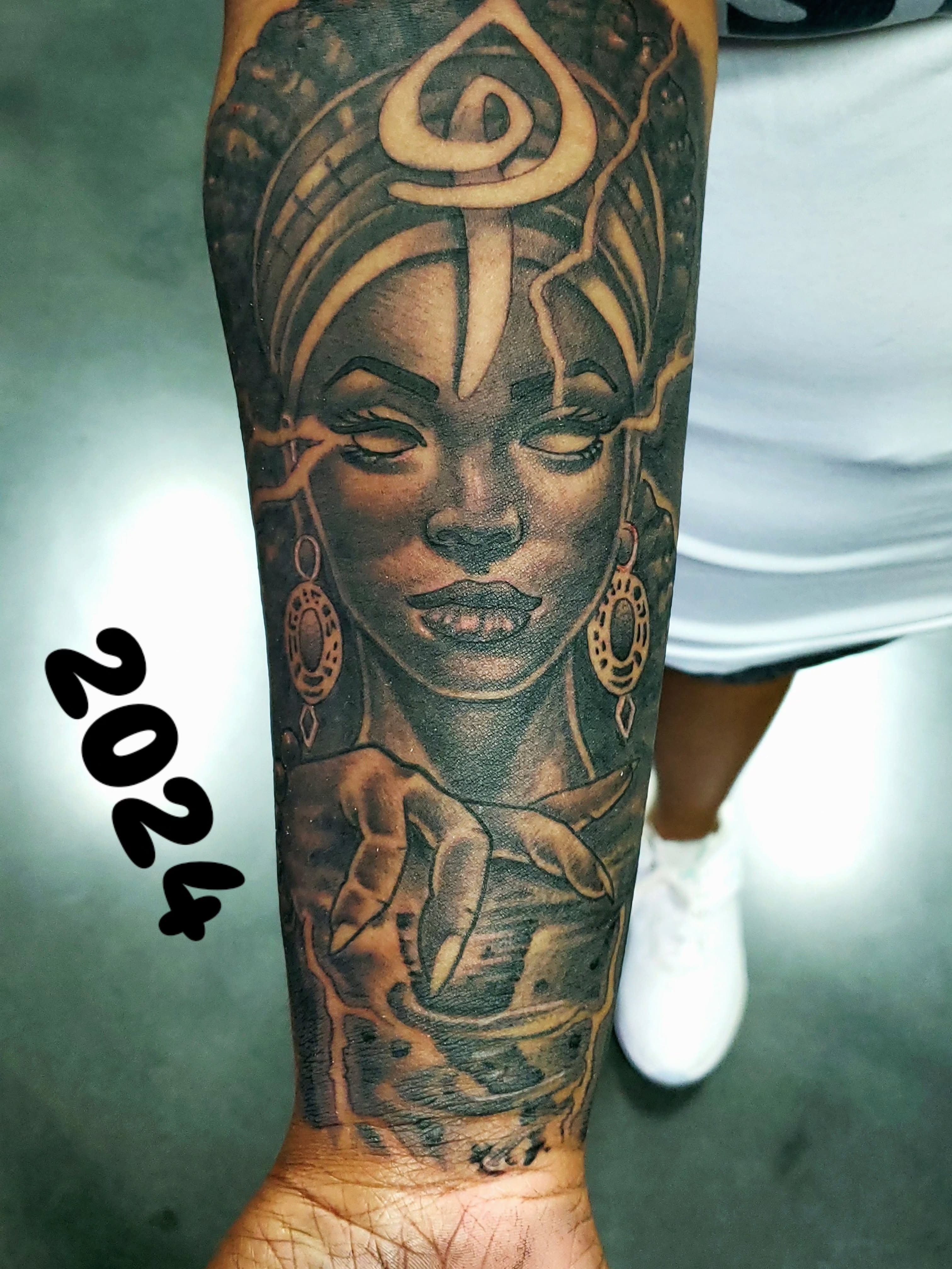 Woman with headdress realism tattoo on the forearm by Cee Vann, Greensboro, North Carolina
