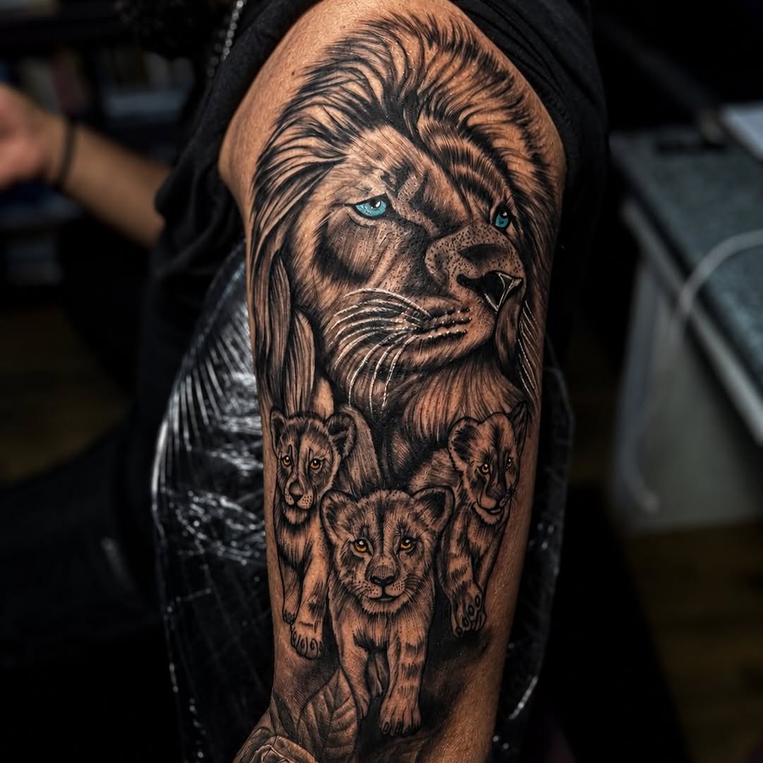 Lion and cubs realism tattoo on the forearm by PMU Artist