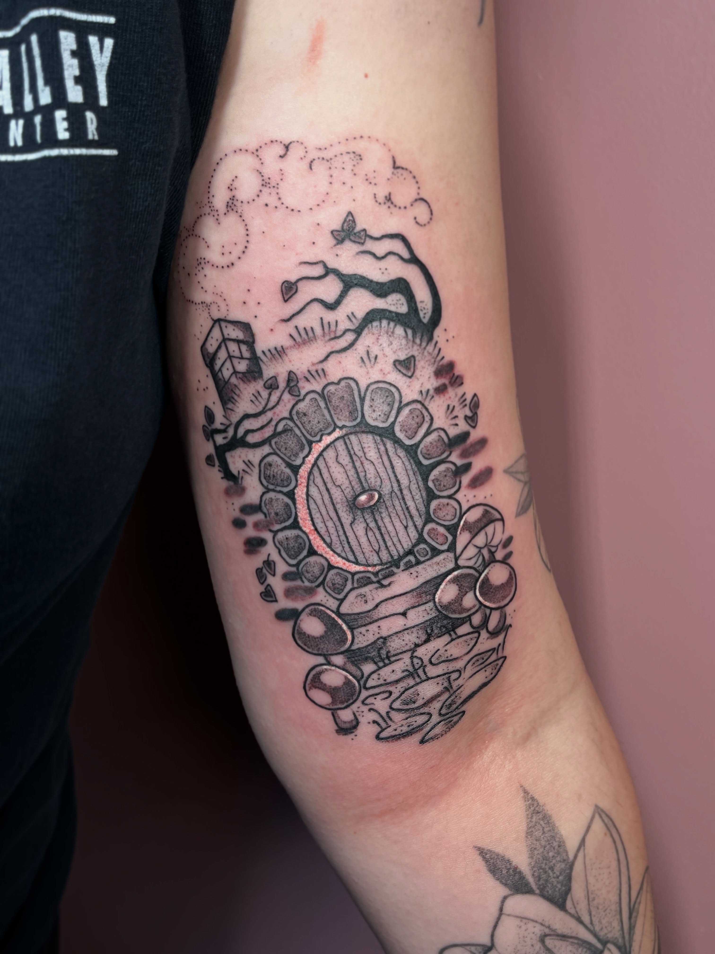 Doorway with landscape dotwork tattoo on the forearm by Allyson Blessing Tattoos