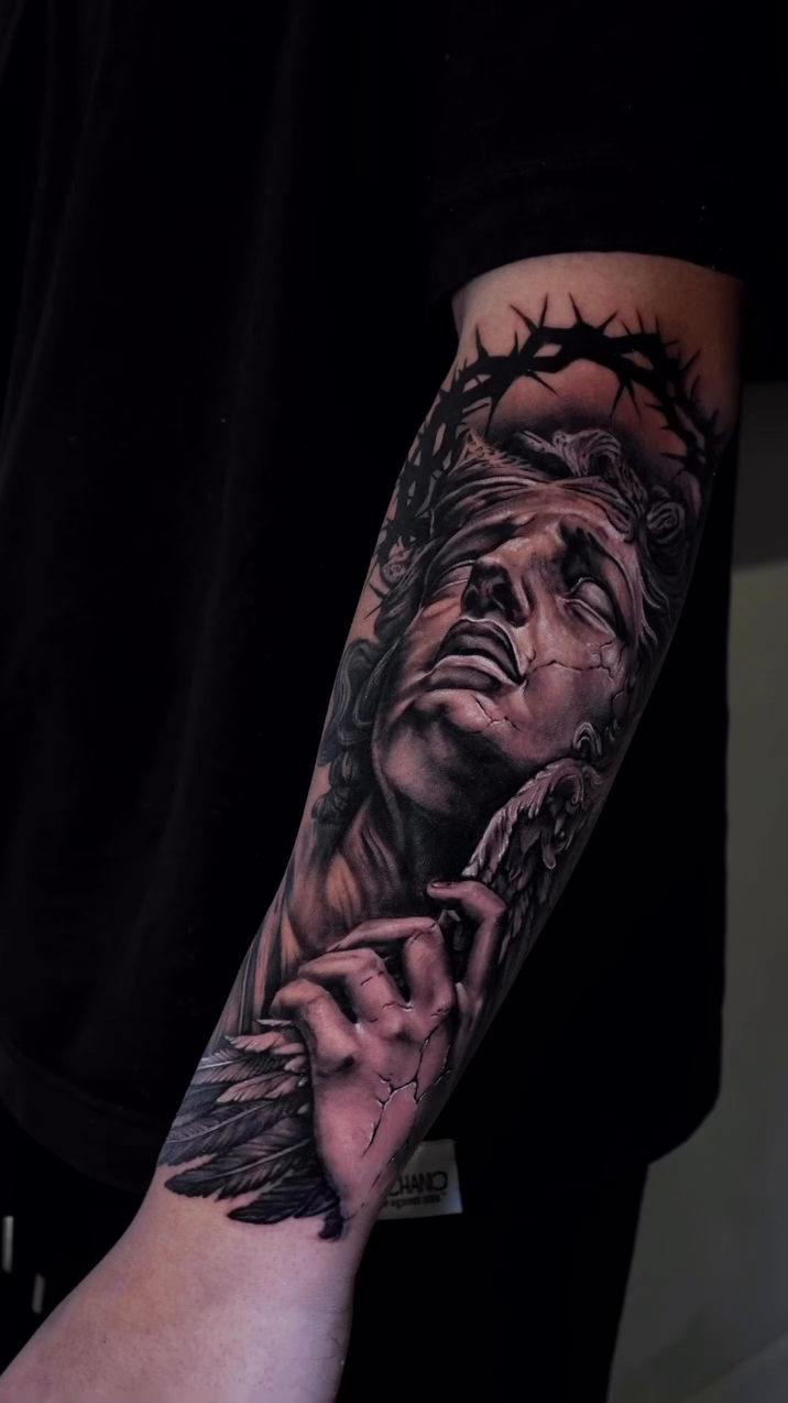 Jesus Christ portrait realism tattoo on the forearm by Alberto M