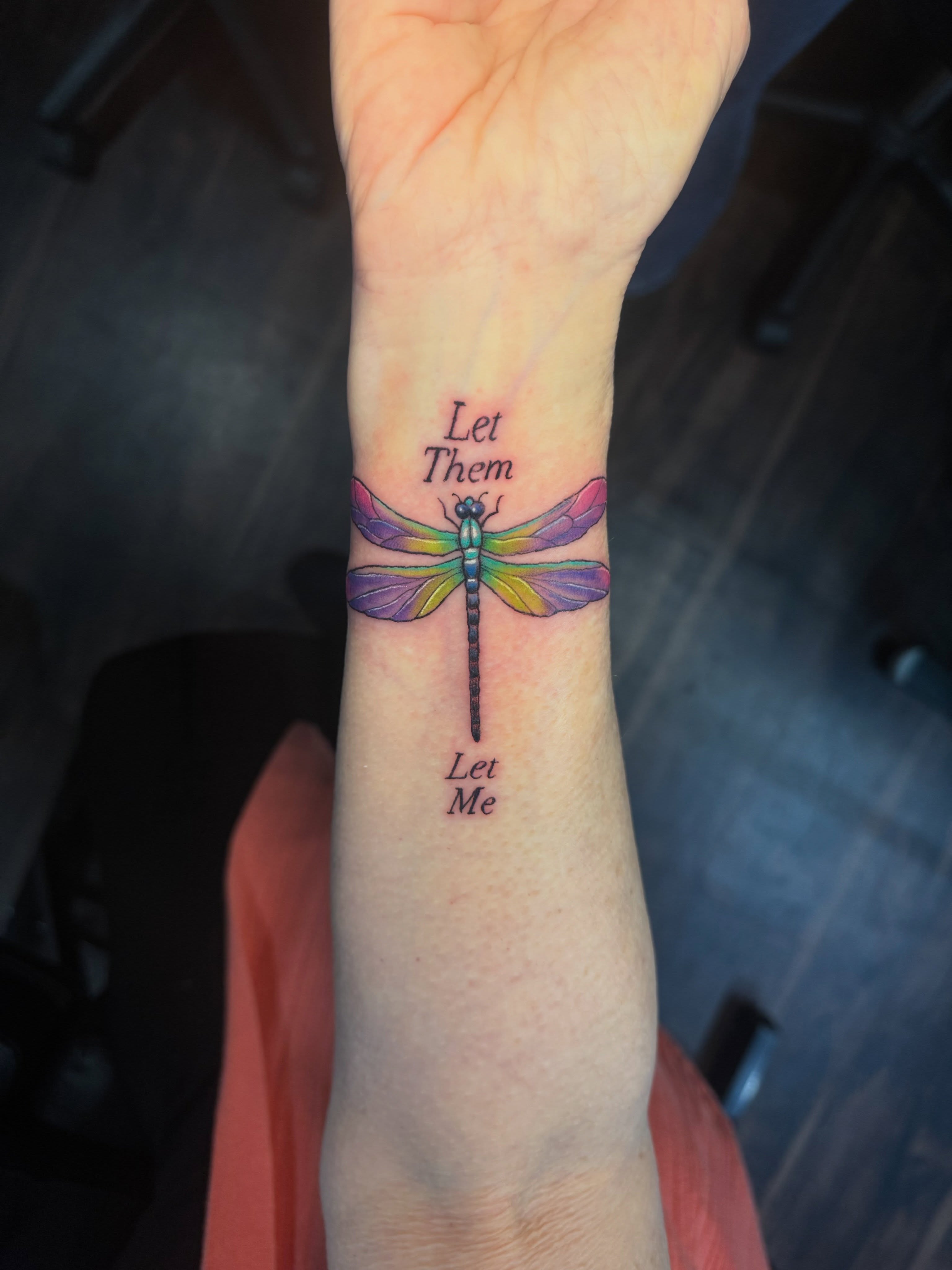 Dragonfly dotwork tattoo on the forearm by Lily Nurnberger