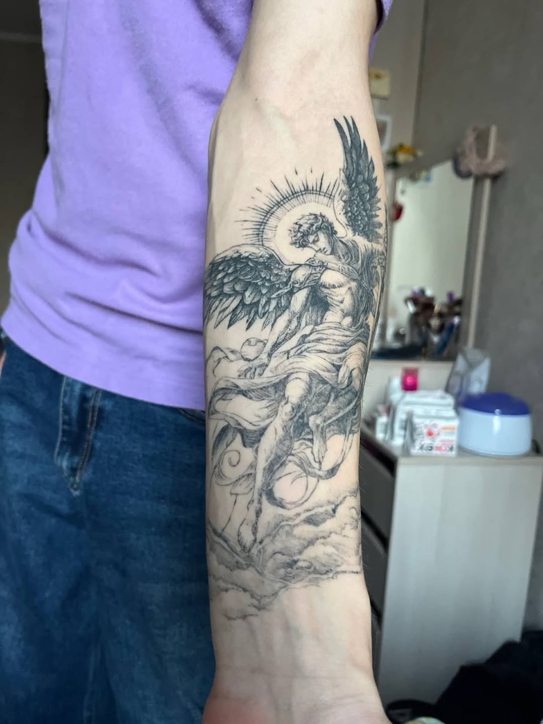 Angel realism tattoo on the forearm by Alexey Molyarenko